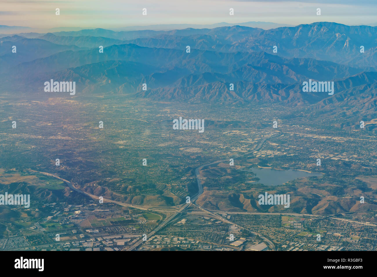 Aerial view of San Dimas and Puddingstone Reservoir, view from window seat in an airplane