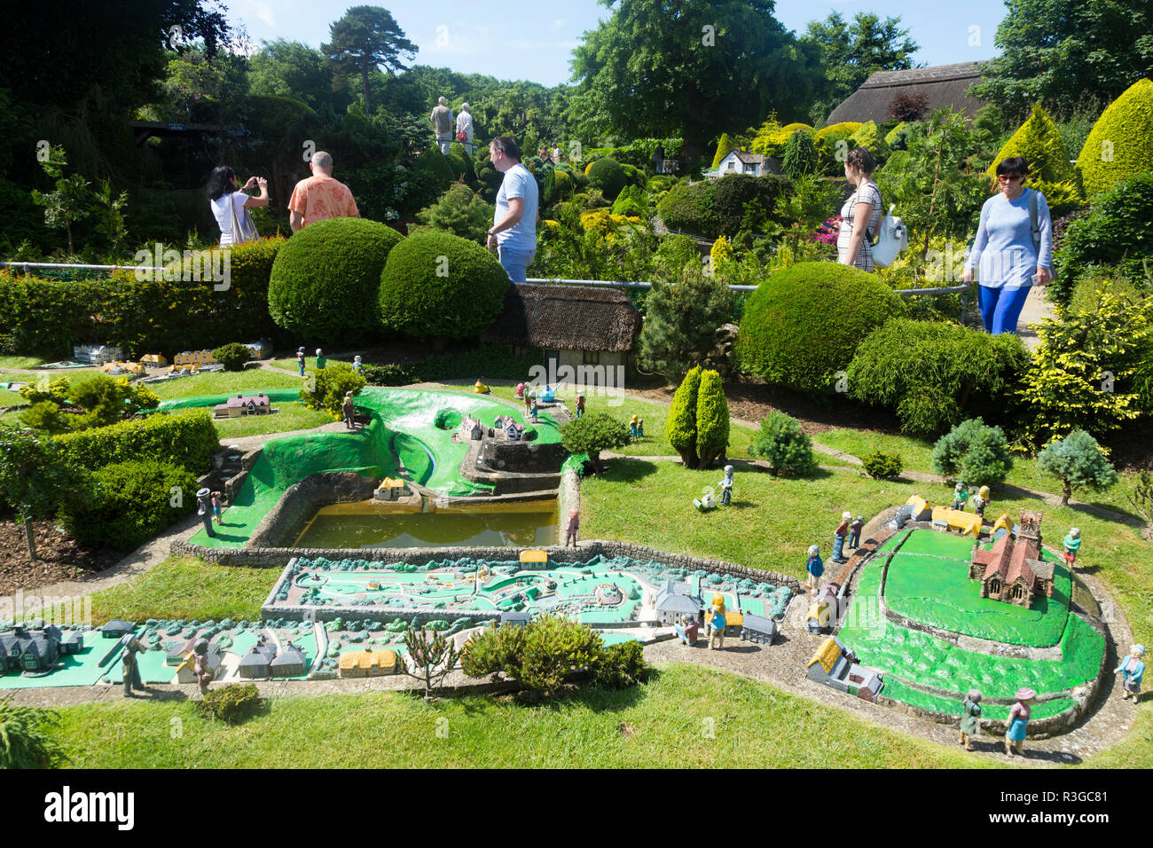 Visitors Tourists People Visit The Garden Miniature Buildings And 