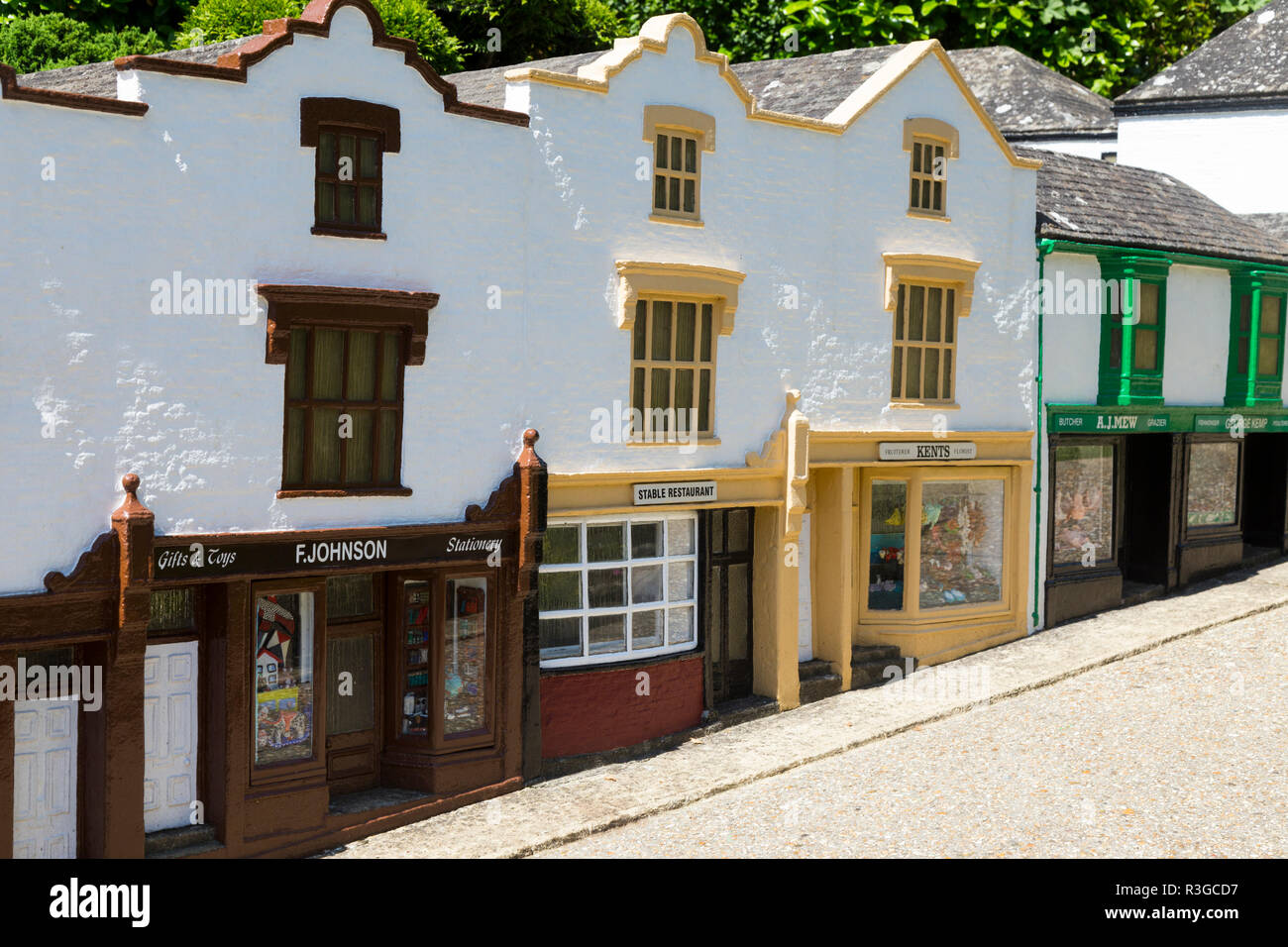 A terrace / terraced row of miniature shop buildings including shops and houses inside the Model Village. Godshill, Ventnor, Isle of Wight UK (98) Stock Photo