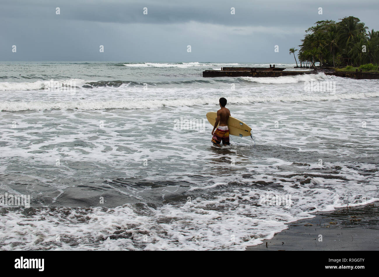 Surfer in Playa Negra, Costa Rica. Stock Photo