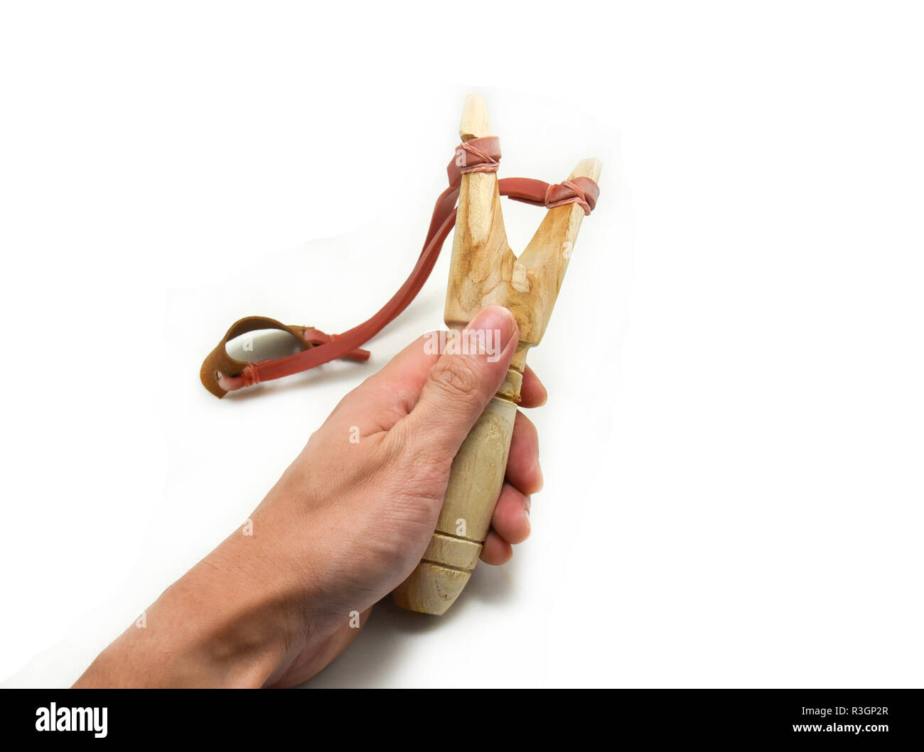 wood catapult (slingshot) in hand on white background Stock Photo Alamy
