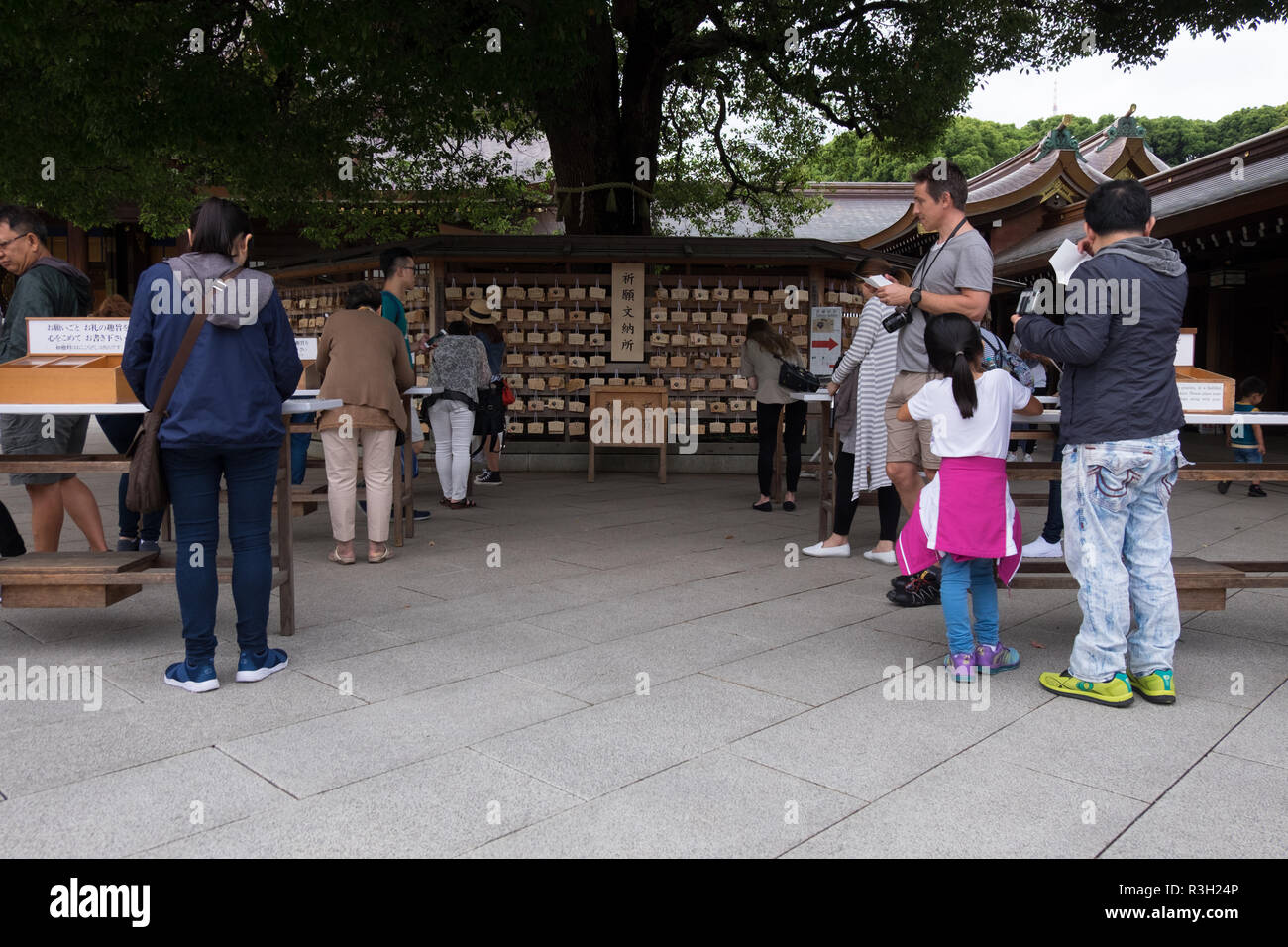 Emas, or prayer boards, being written and places by worshippers at Mejii Jingo in Tokyo, Japan. Stock Photo
