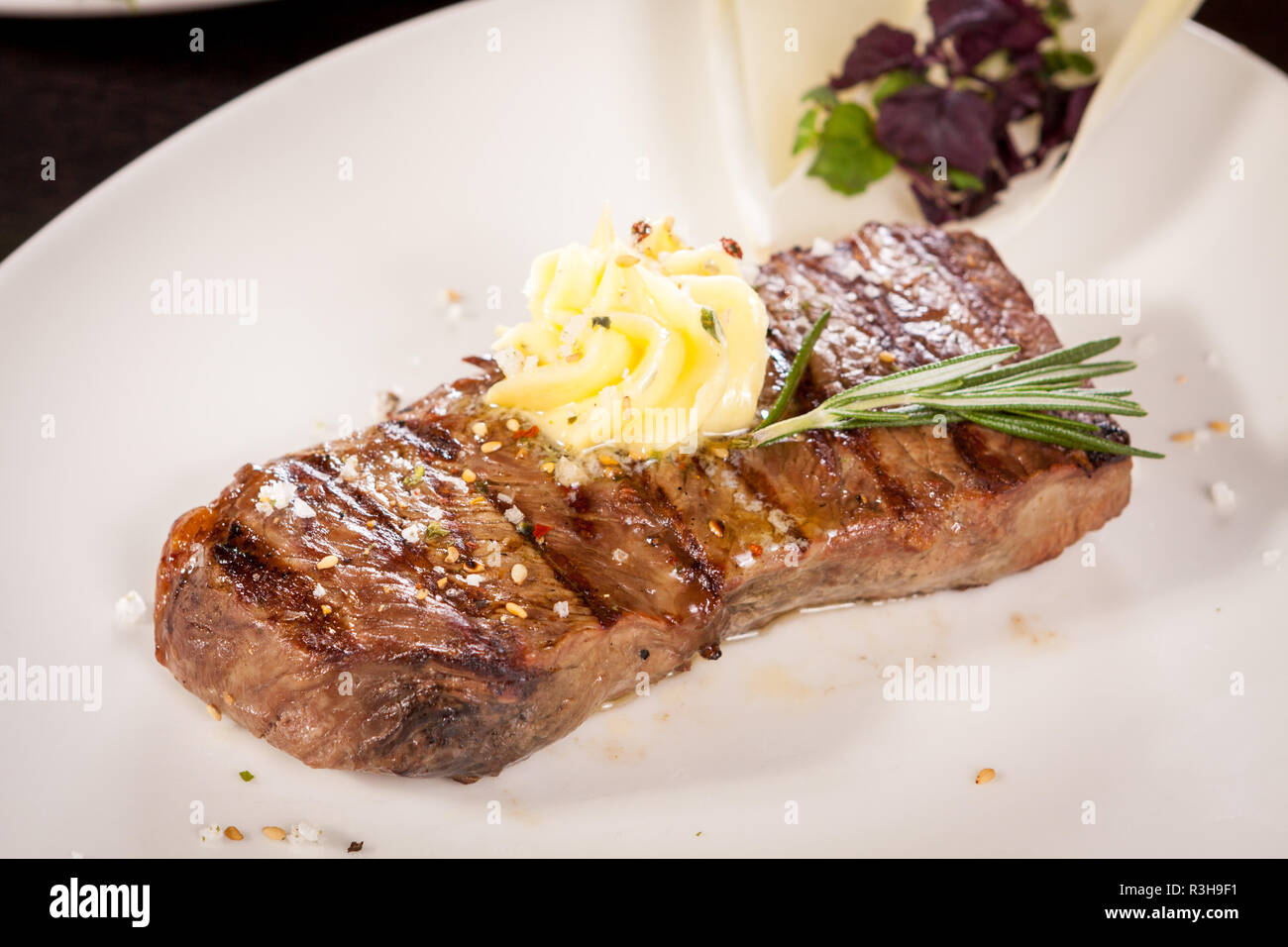 juicy grilled sirloin steak with homemade herb butter Stock Photo - Alamy