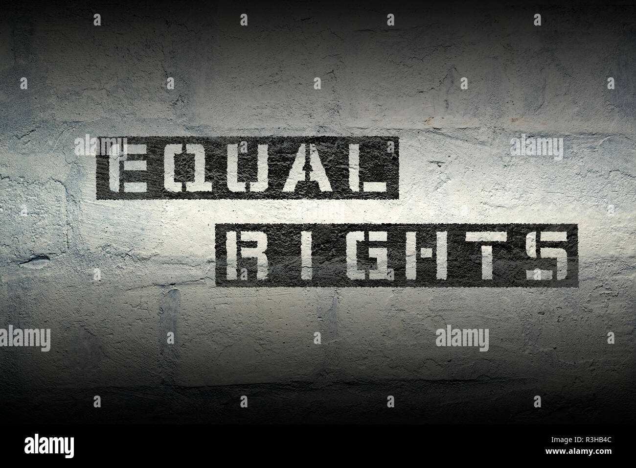 equal rights stencil print on the grunge white brick wall Stock Photo