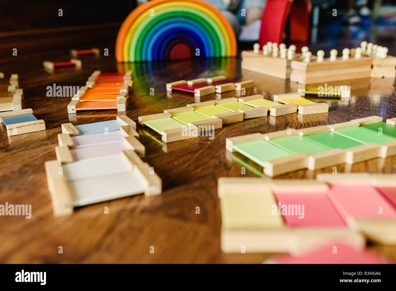 Children playing with wooden rainbow waldorf montessori Stock Photo - Alamy