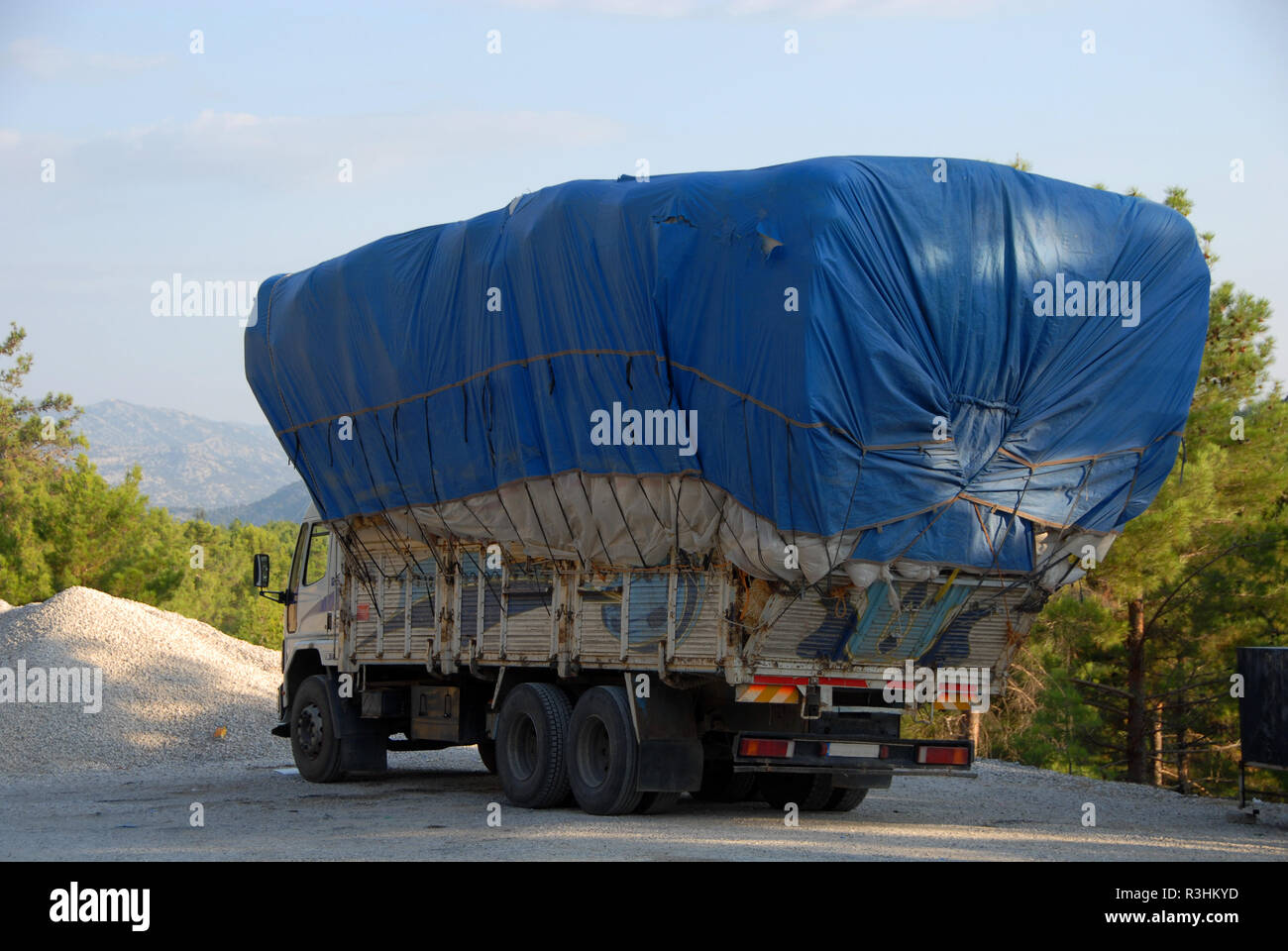 Truck Travelling On Roadway Heavily Overloaded By Wood Stock Photo -  Download Image Now - iStock