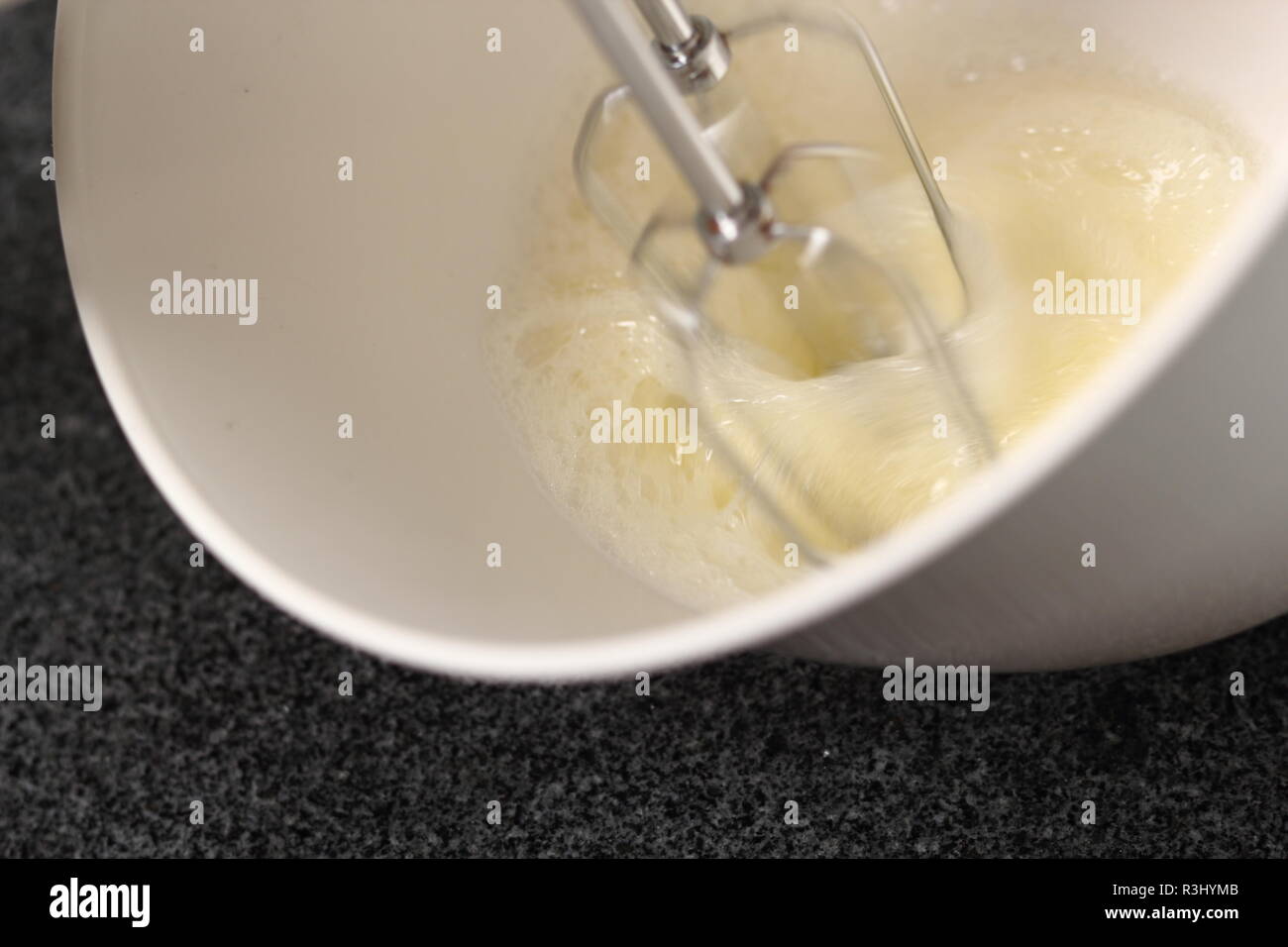 Whisking egg whites with handheld mixer. Making Cider Pie Series Stock