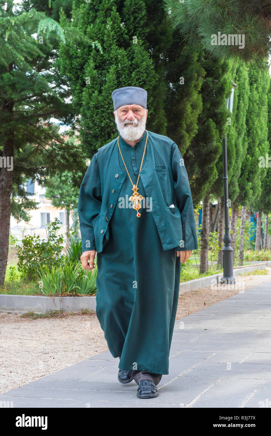 Orthodox pope walking in a park, Tbilisi, Georgia Stock Photo