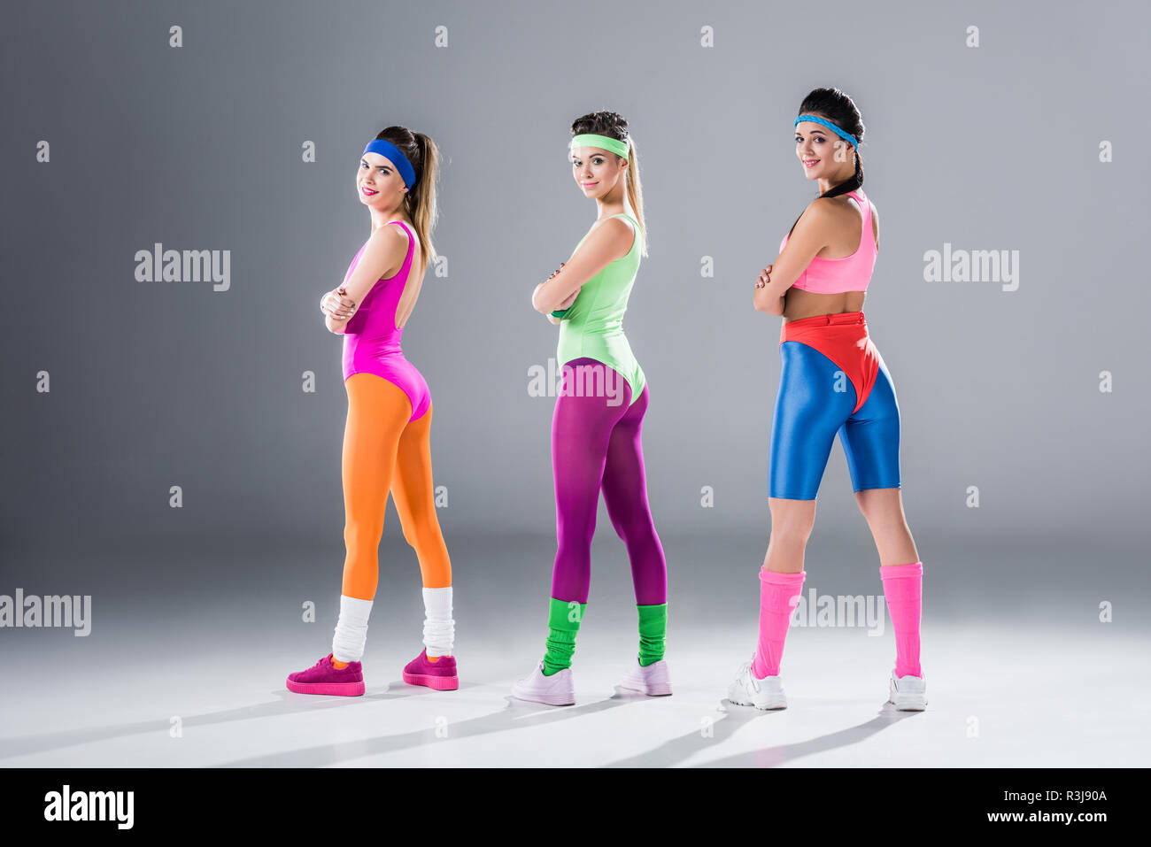 female model with long red hair and athletic body shape, posing for fitness  club advertisment, wears comfortable colorful aerobics outfit, smiles joyf  Stock Photo - Alamy