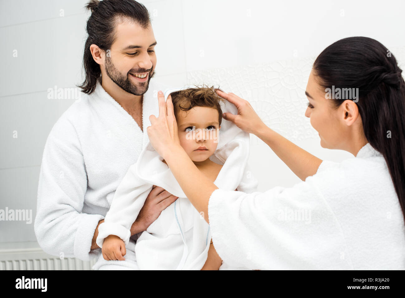 Mom dad smiling son in hi-res stock photography and images - Alamy