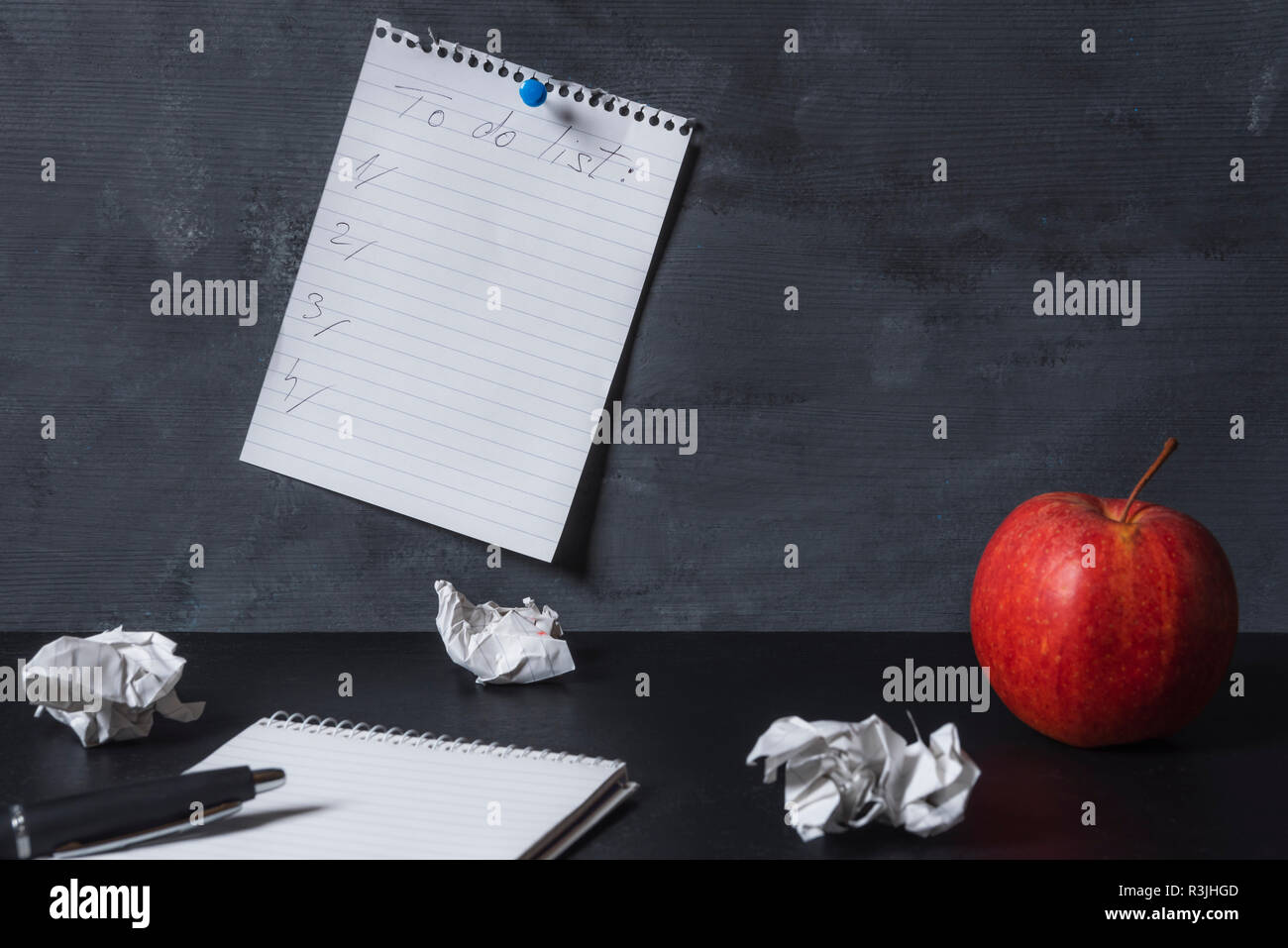 Paper notebook with blank pages, crumpled paper balls and