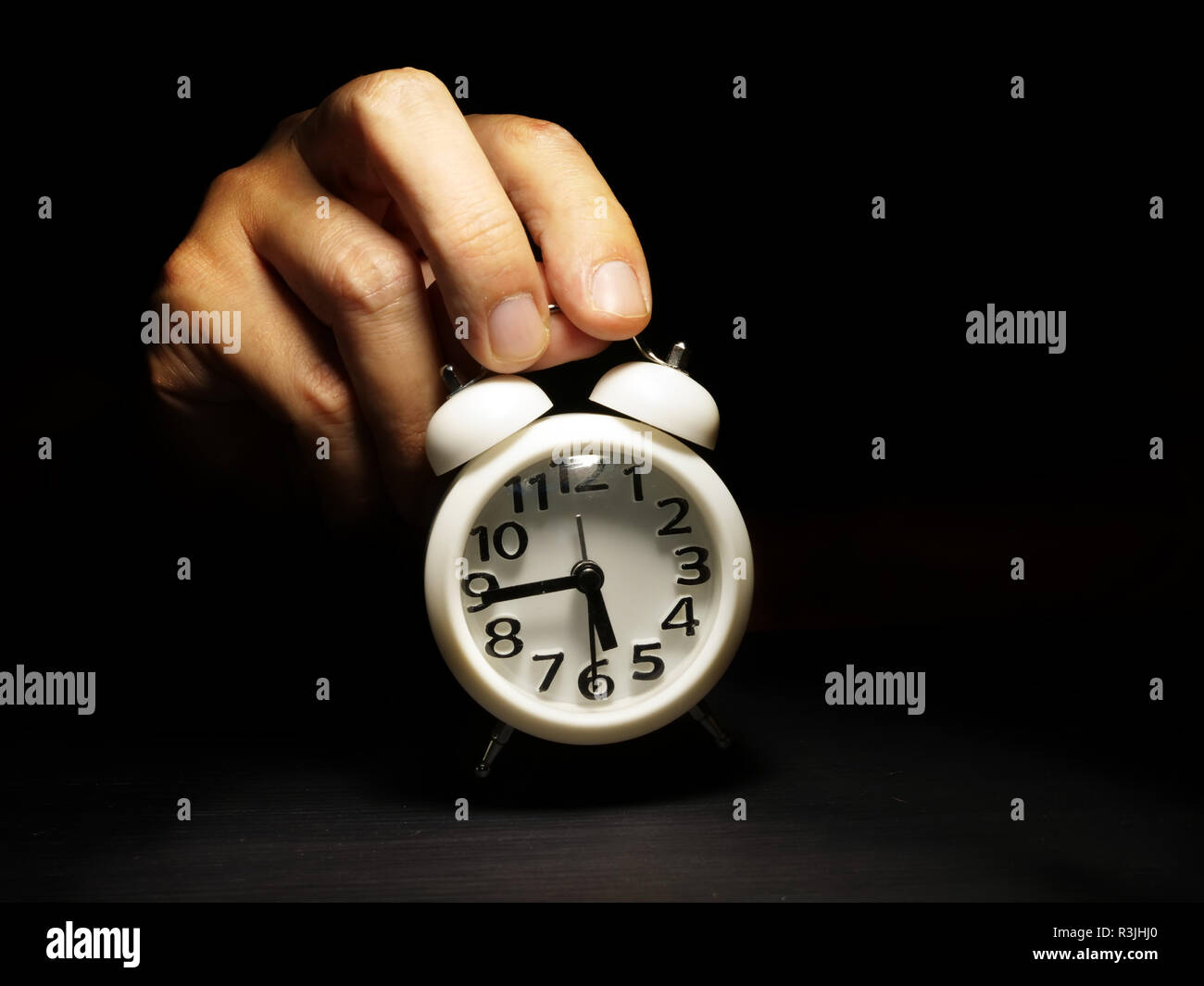 Time management. Hand is holding alarm clock. Stock Photo