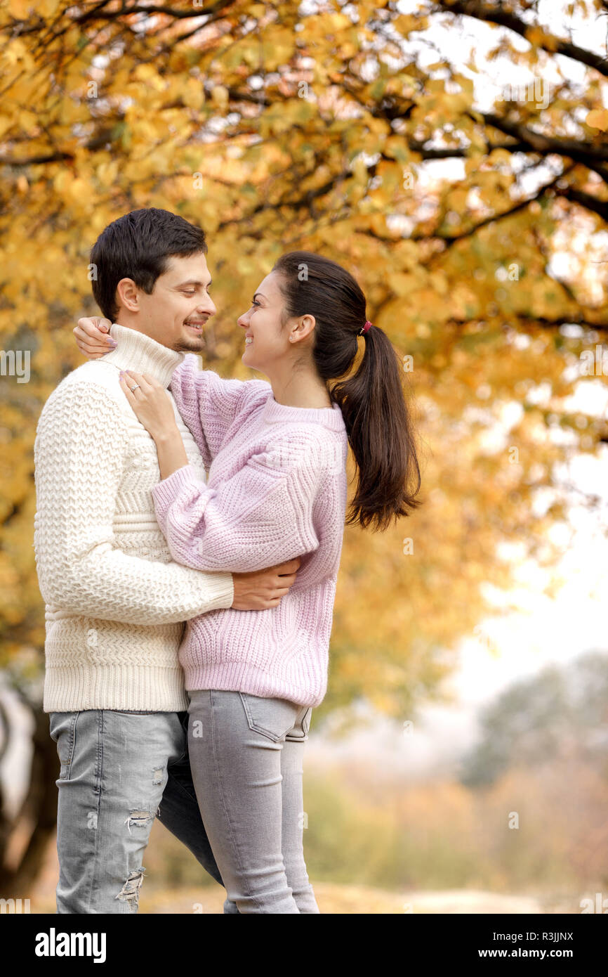 Couple in love in the autumn leaves Stock Photo - Alamy