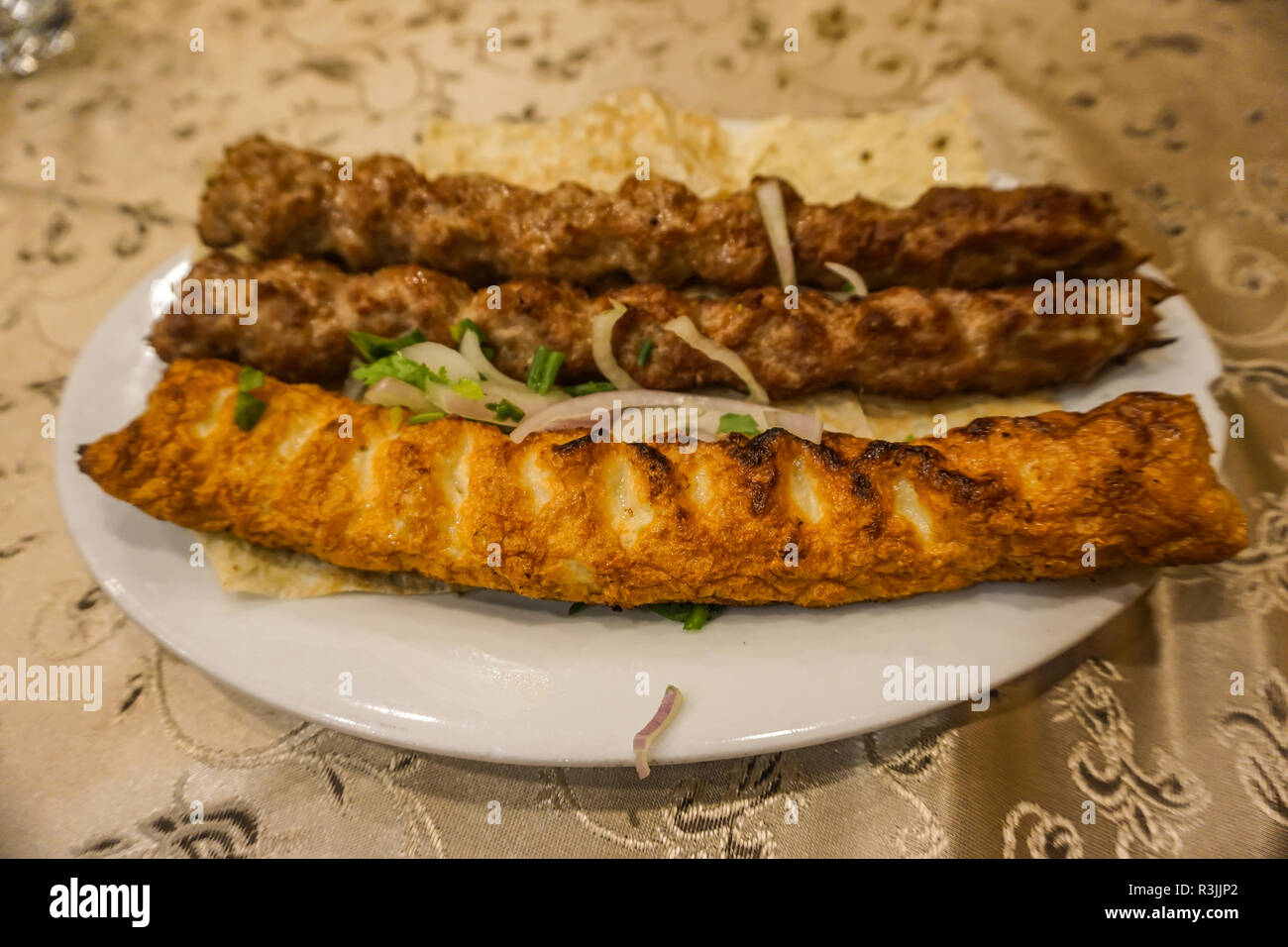 Armenian Unique Fish and Crab Kabab Served with Onions on a Plate Stock Photo