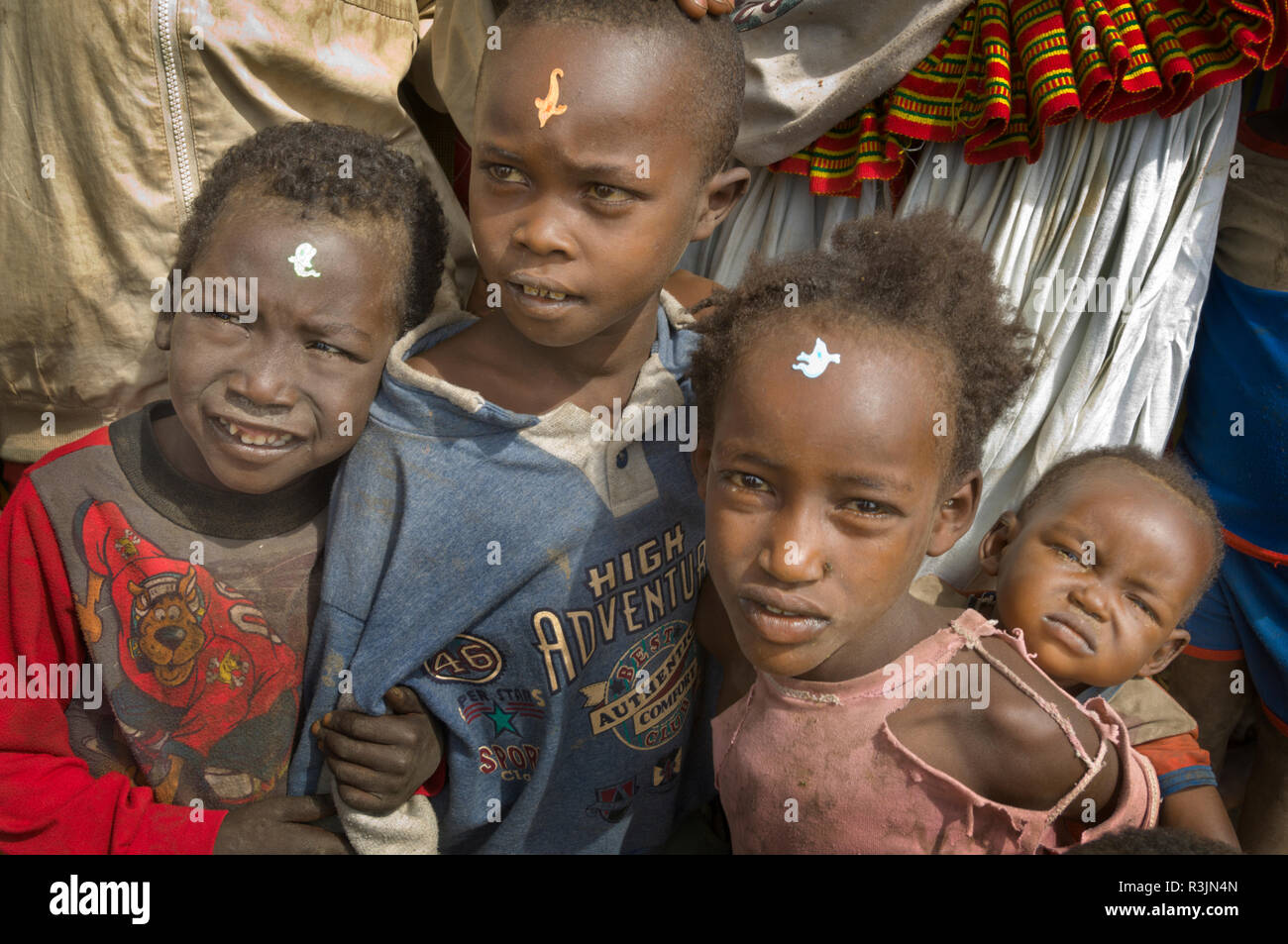 Africa, Ethiopia, Omo region. Children with stickers on their foreheads in the Konso tribe village of Busso. Stock Photo