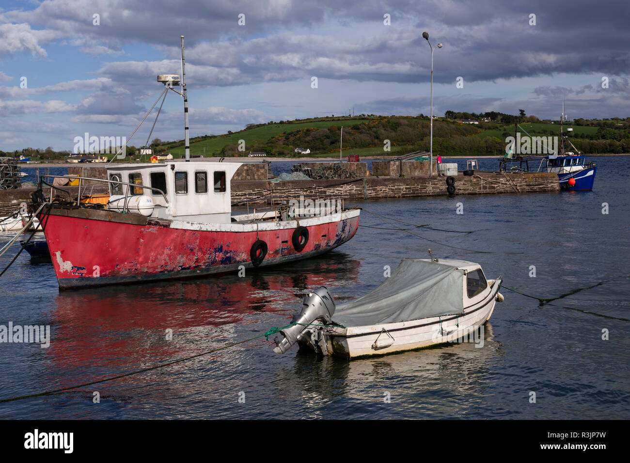 Red fishing boat in the harbour at Youghal, County Cork, Ireland Stock Photo
