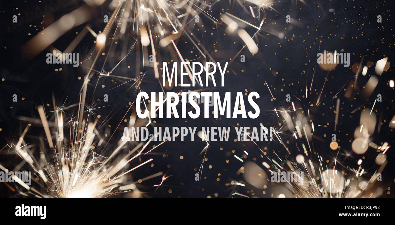 Border with burning sparklers and text Merry Christmas and Happy New Year Stock Photo