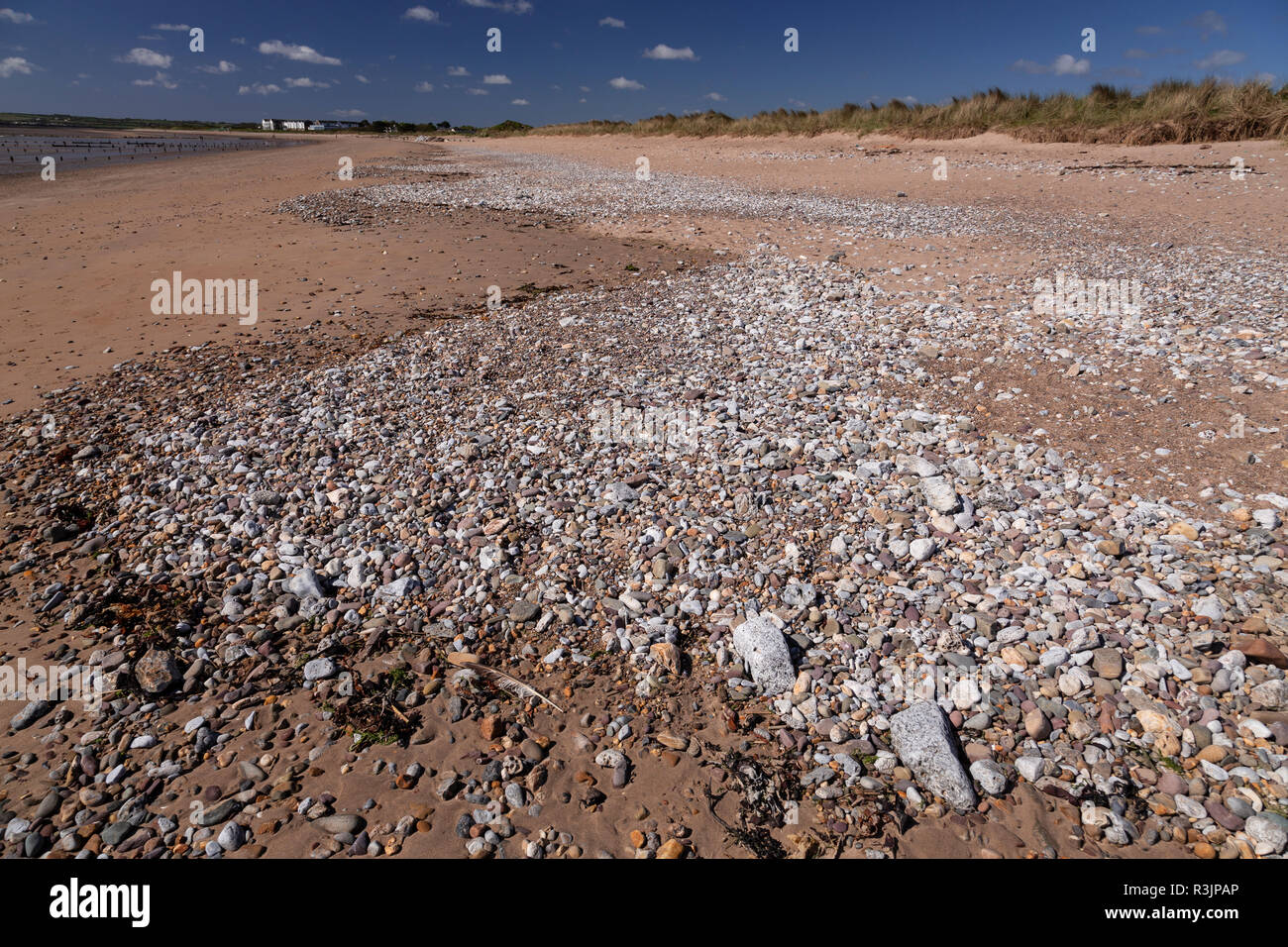 Pebbles in a wave pattern at Youghal beach, County Cork, Ireland Stock Photo