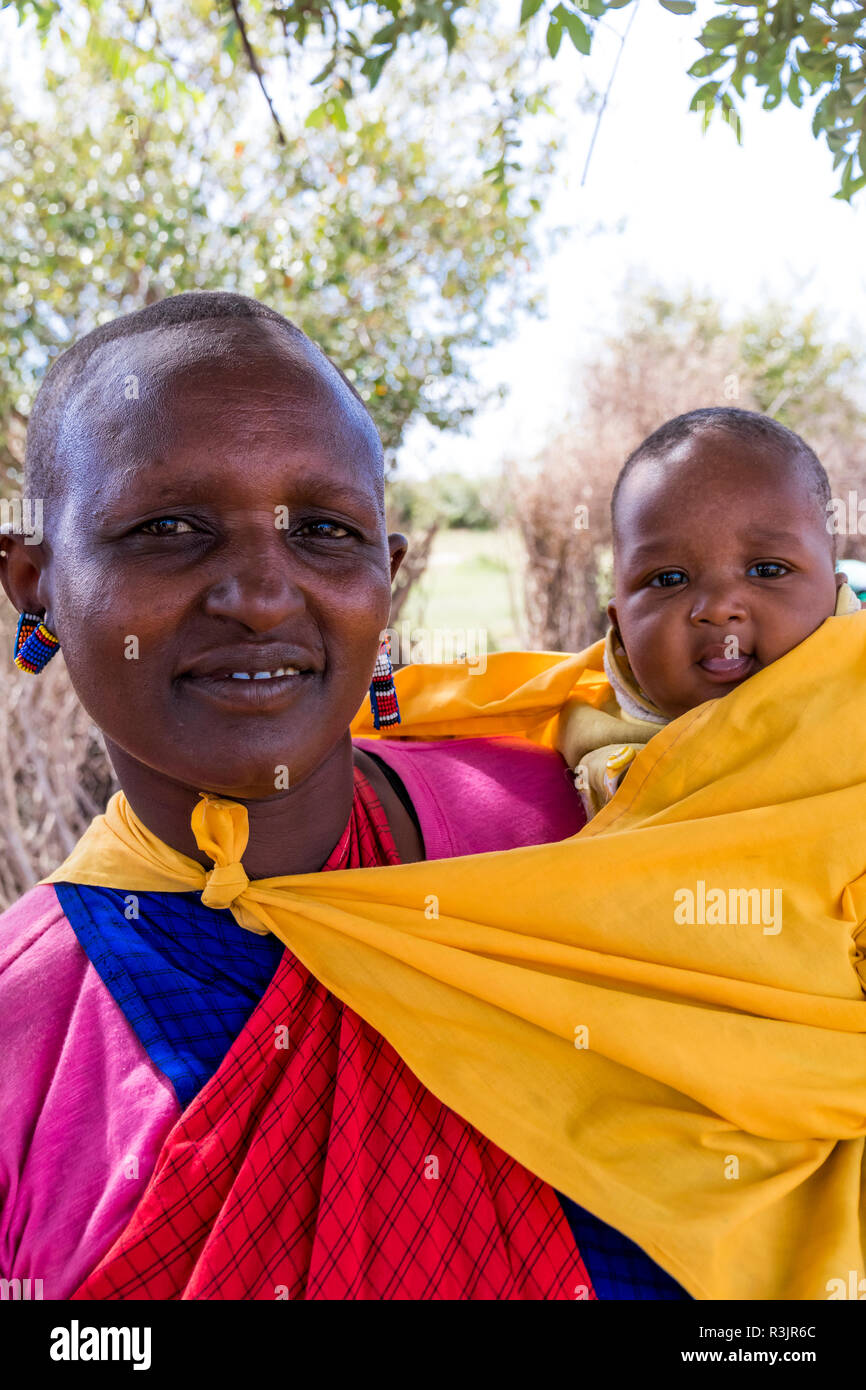 Africa, Kenya, Masai Mara National Reserve, Mara Ashnil region. Masai tribal jewelry and ornamentation. Mother and child. Stock Photo