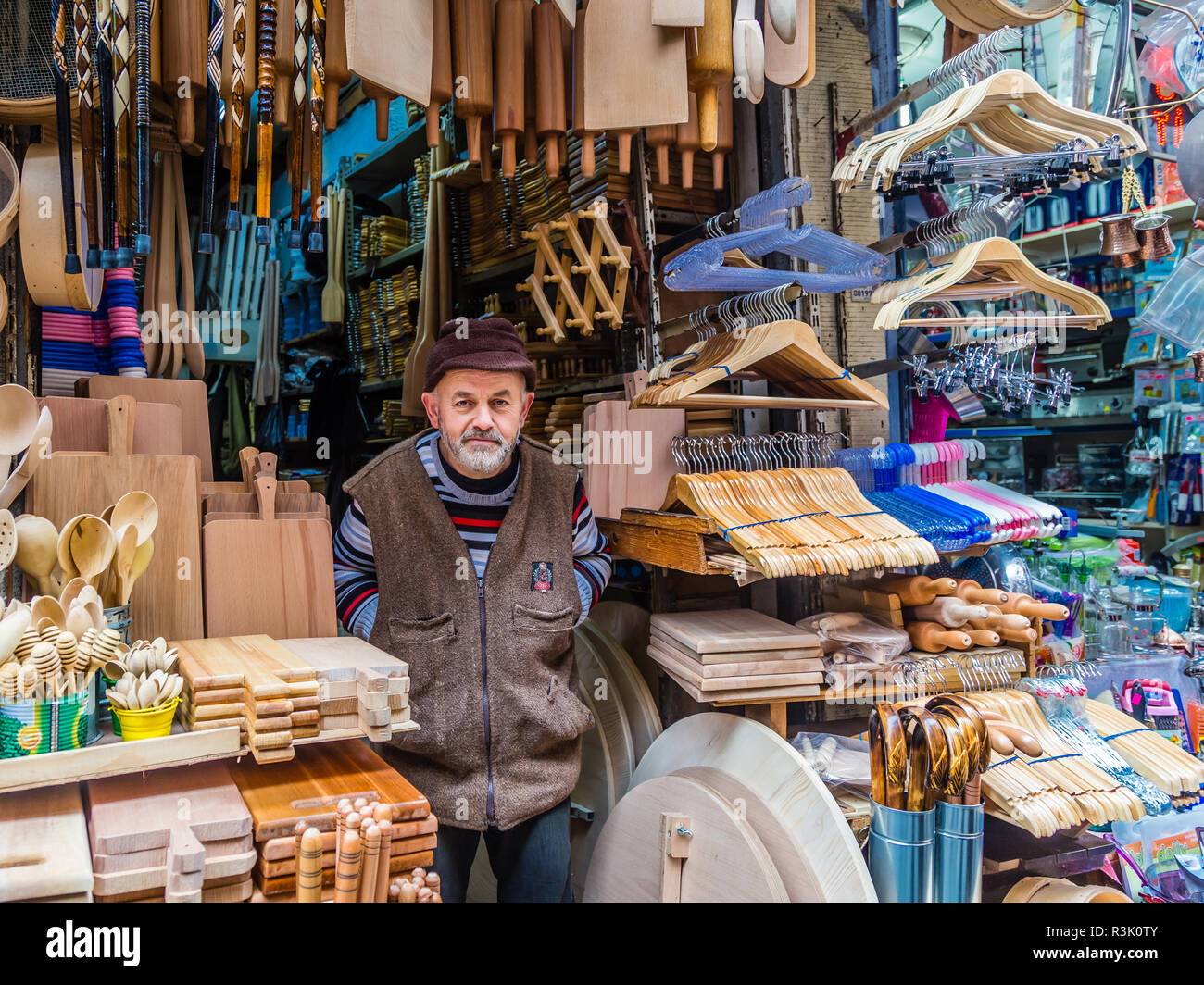 Istanbul, Turkey, Fecruary 23, 2013: Man selling wooden goods from a shop in Eminonu. Stock Photo