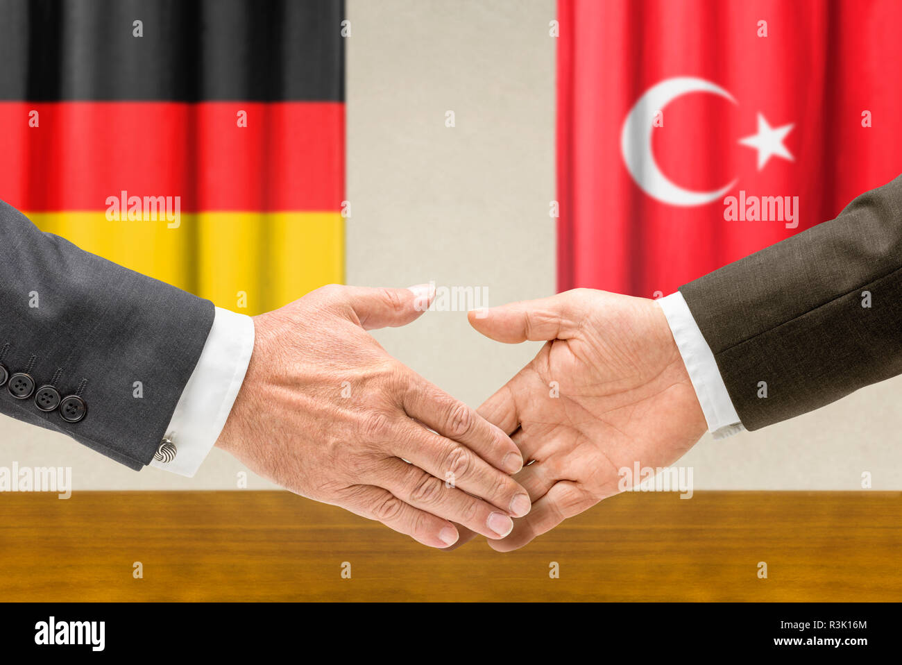 representatives of germany and turkey shake hands Stock Photo