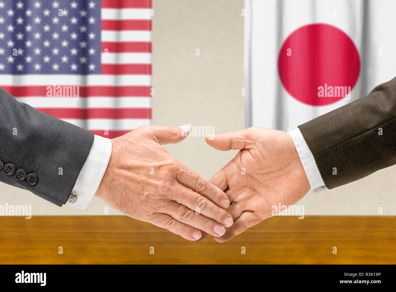 us and japanese representatives shake hands Stock Photo Alamy