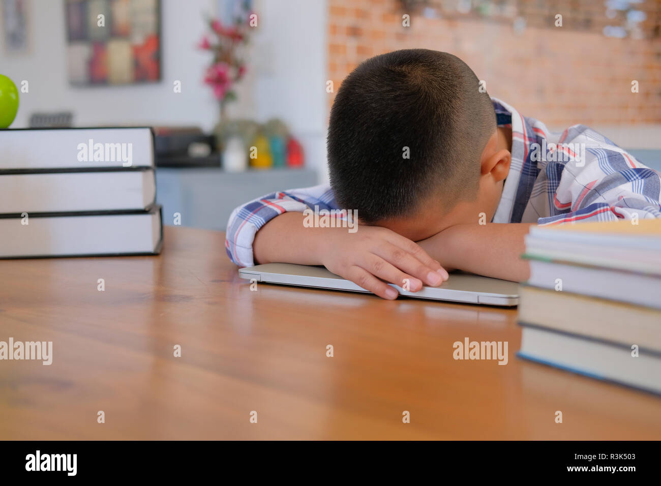 Lazy Stressed Young Little Asian Kid Boy Resting Sleeping On Desk