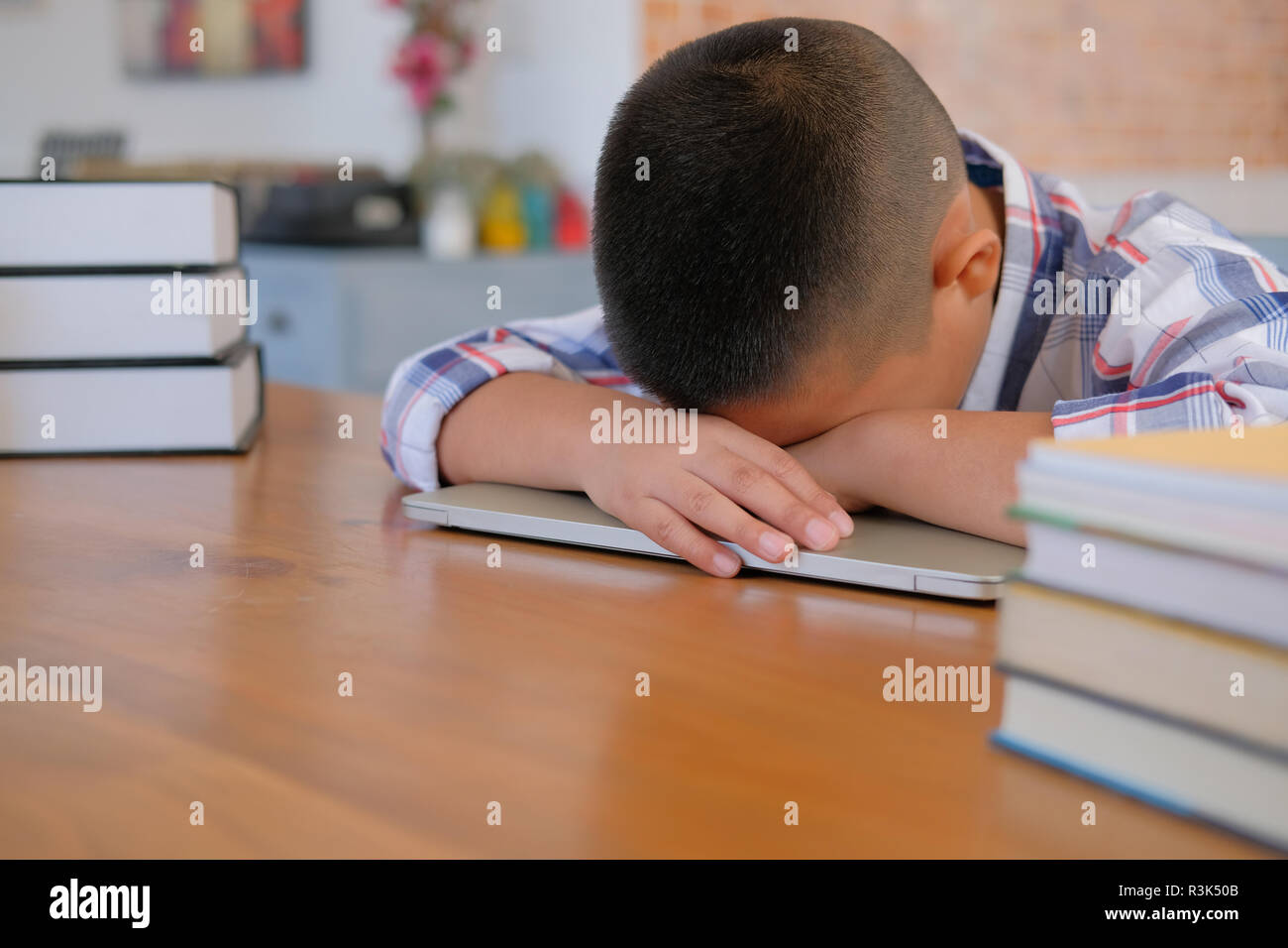 Lazy Stressed Young Little Asian Kid Boy Resting Sleeping On Desk