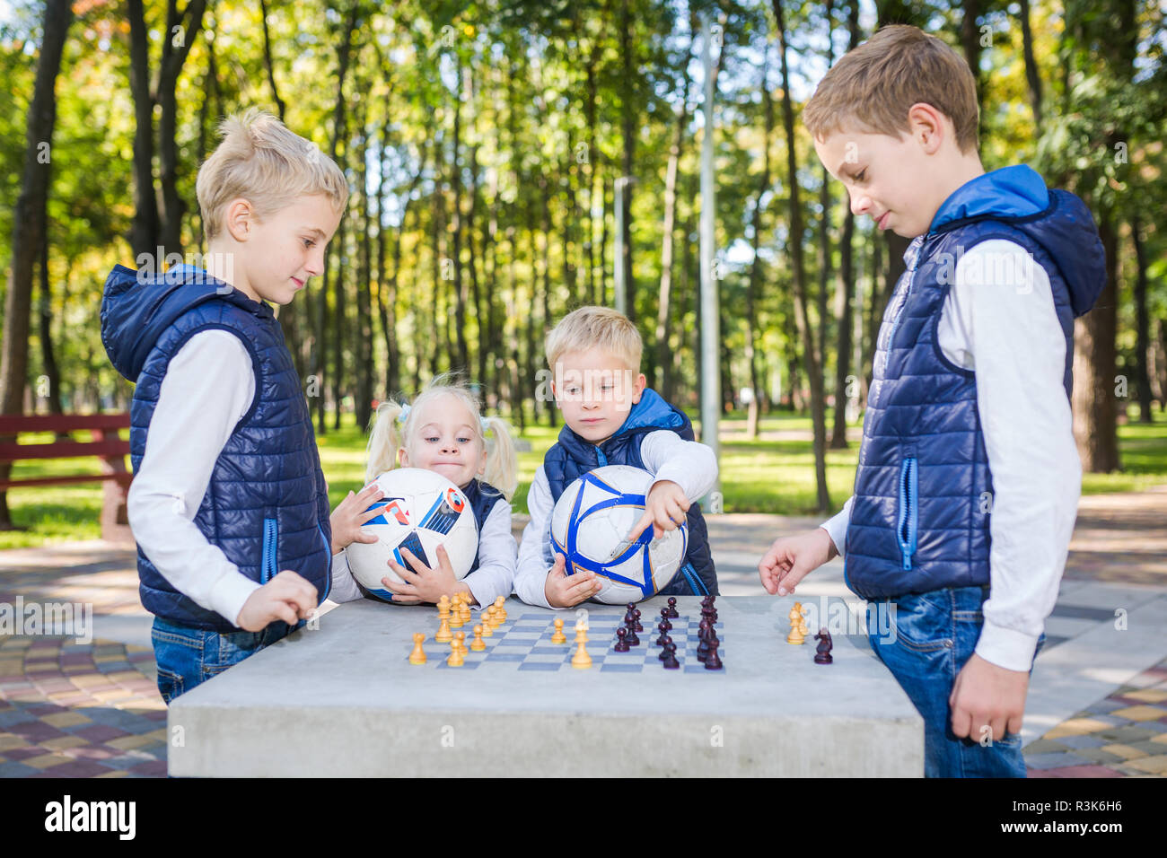 The topic children learning, logical development, mind and math, miscalculation moves advance. large family brothers and sister Caucasian boys and gir Stock Photo