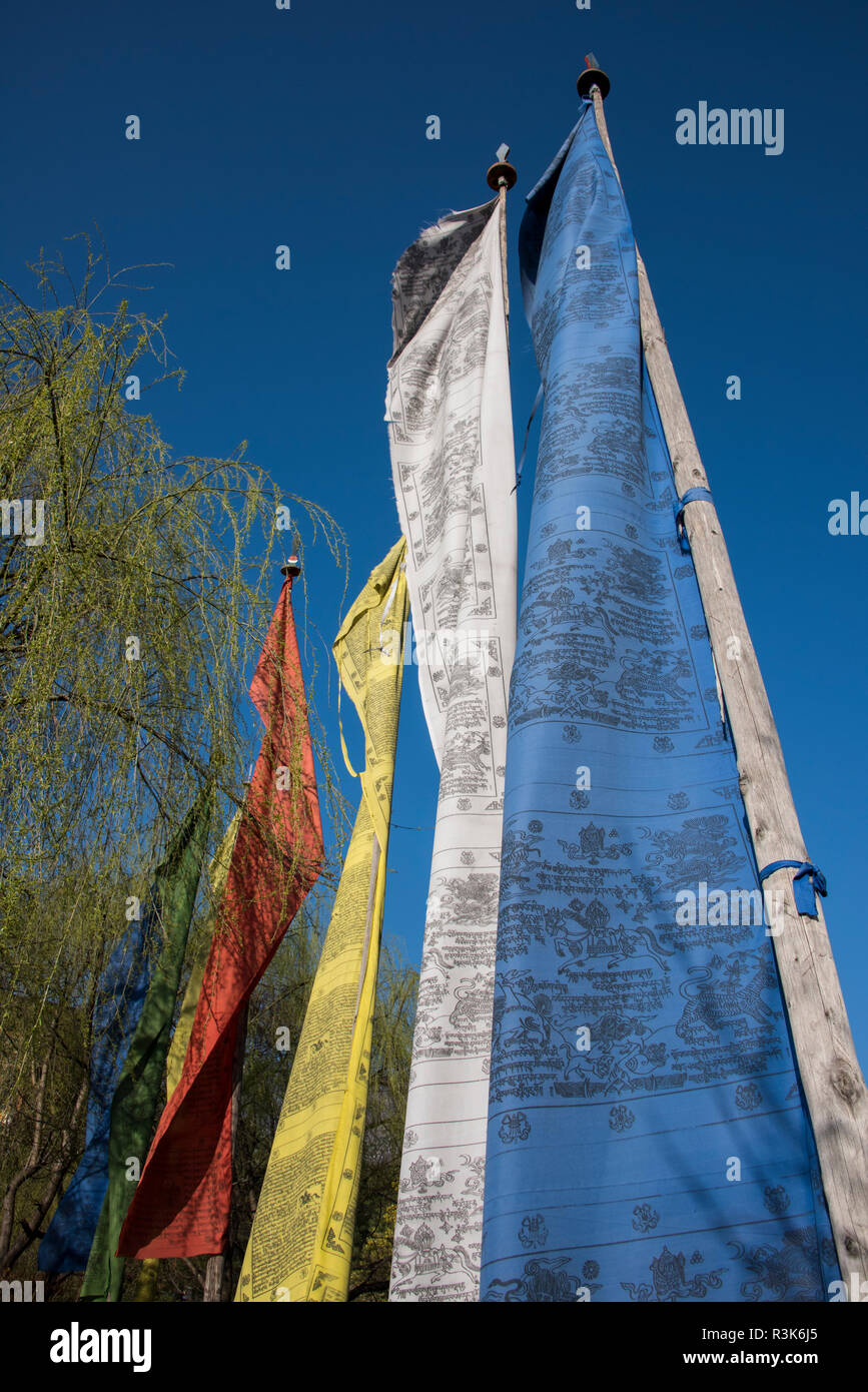 Bhutan, Paro. Detail of colorful prayer flags with blue sky. Stock Photo