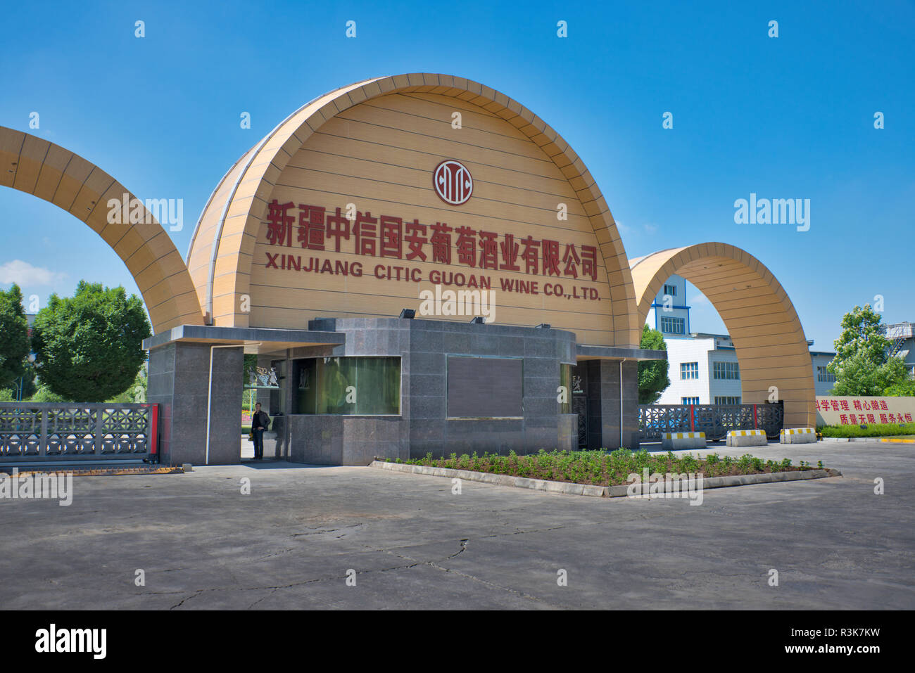 China, Xinjiang province, Xinjiang Uyghur Autonomous Region, Manasi. The anti-terrorist fortified arches of the street entrance to Citic Guoan Winery. Stock Photo