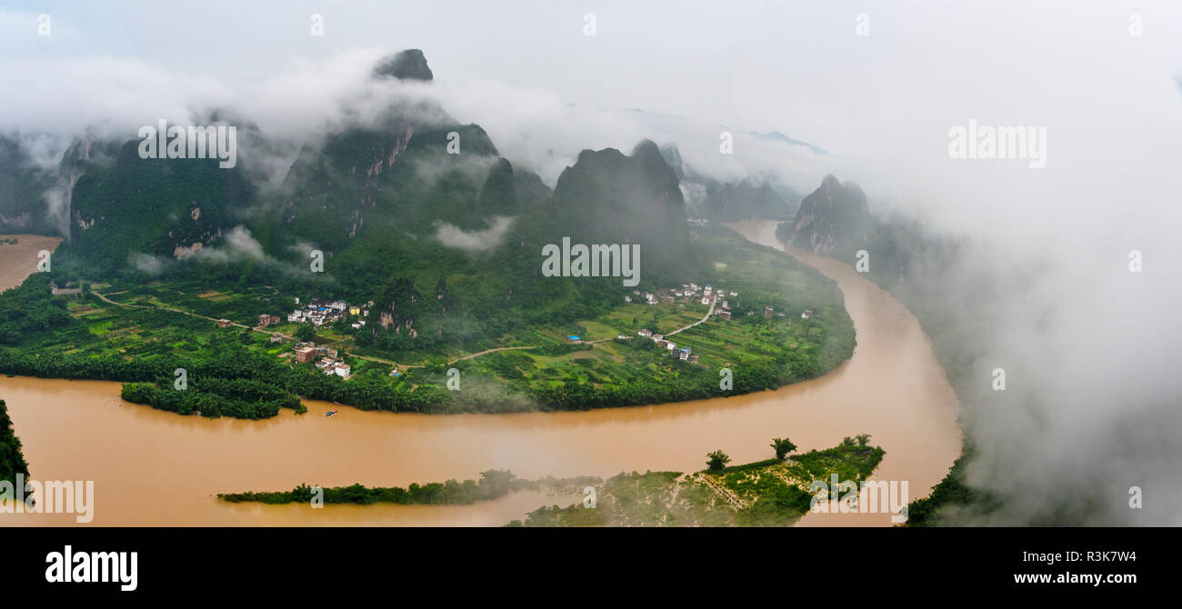Karst hills with Li River in morning mist, Guilin, Guangxi Province, China Stock Photo