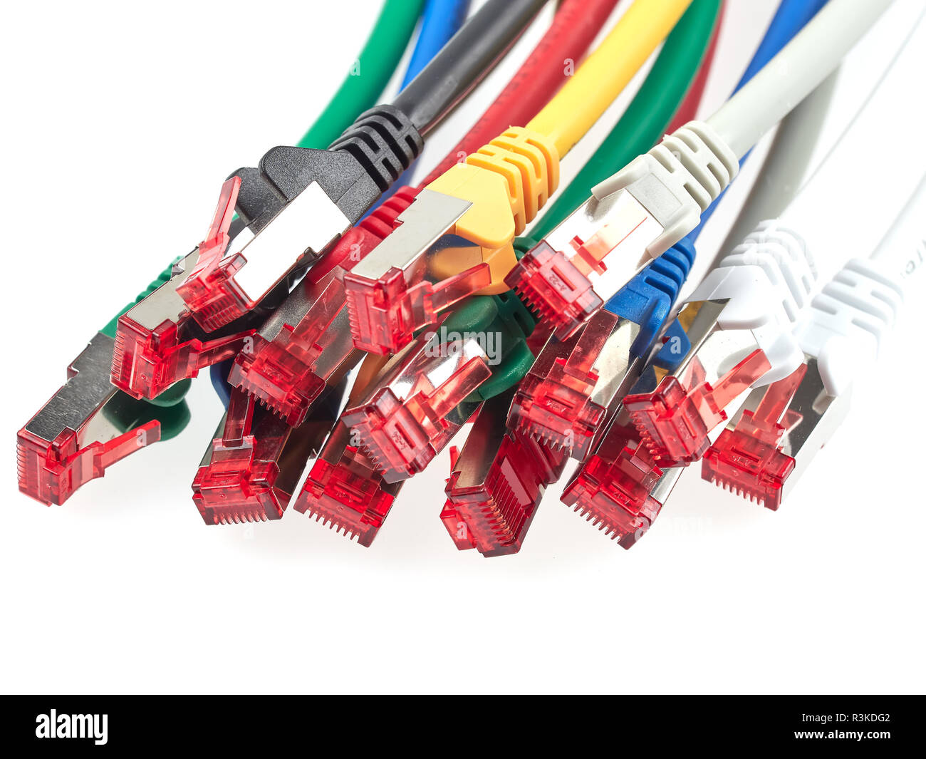 Ethernet patch cables with RJ45 connectors are used to route signals between various network devices Stock Photo