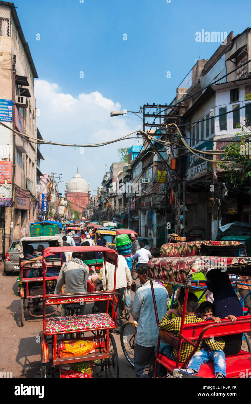 India. Rickshaw-crowded street leading to Jama Masjid mosque in Old Delhi. Stock Photo