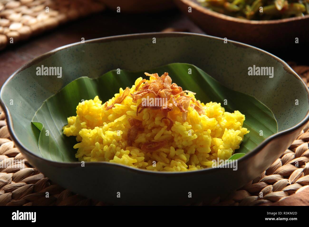 Nasi Kuning. Traditional Indonesian yellow (turmeric) rice,