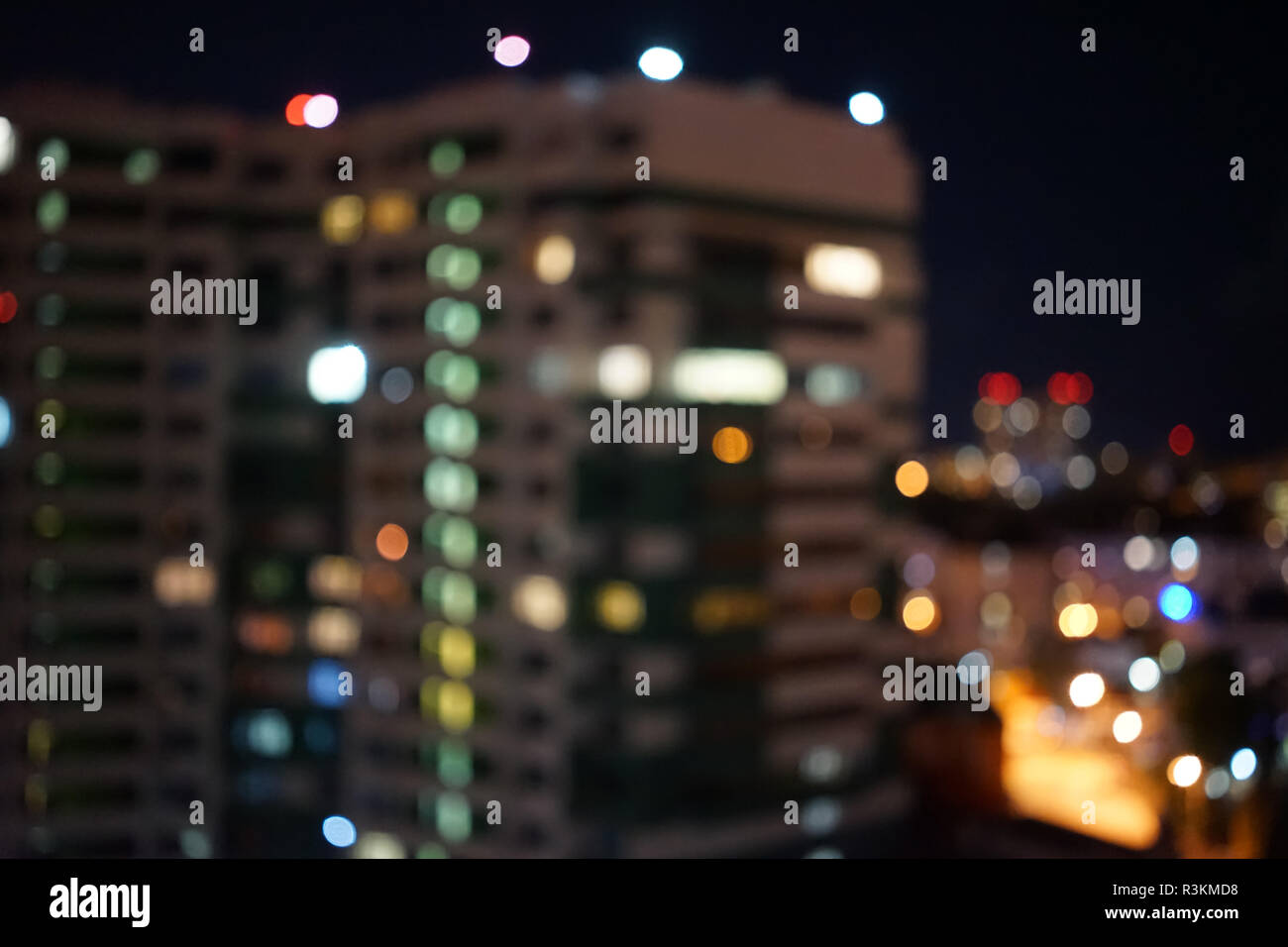 Blurred night city background with high-rise buildings and light Stock ...