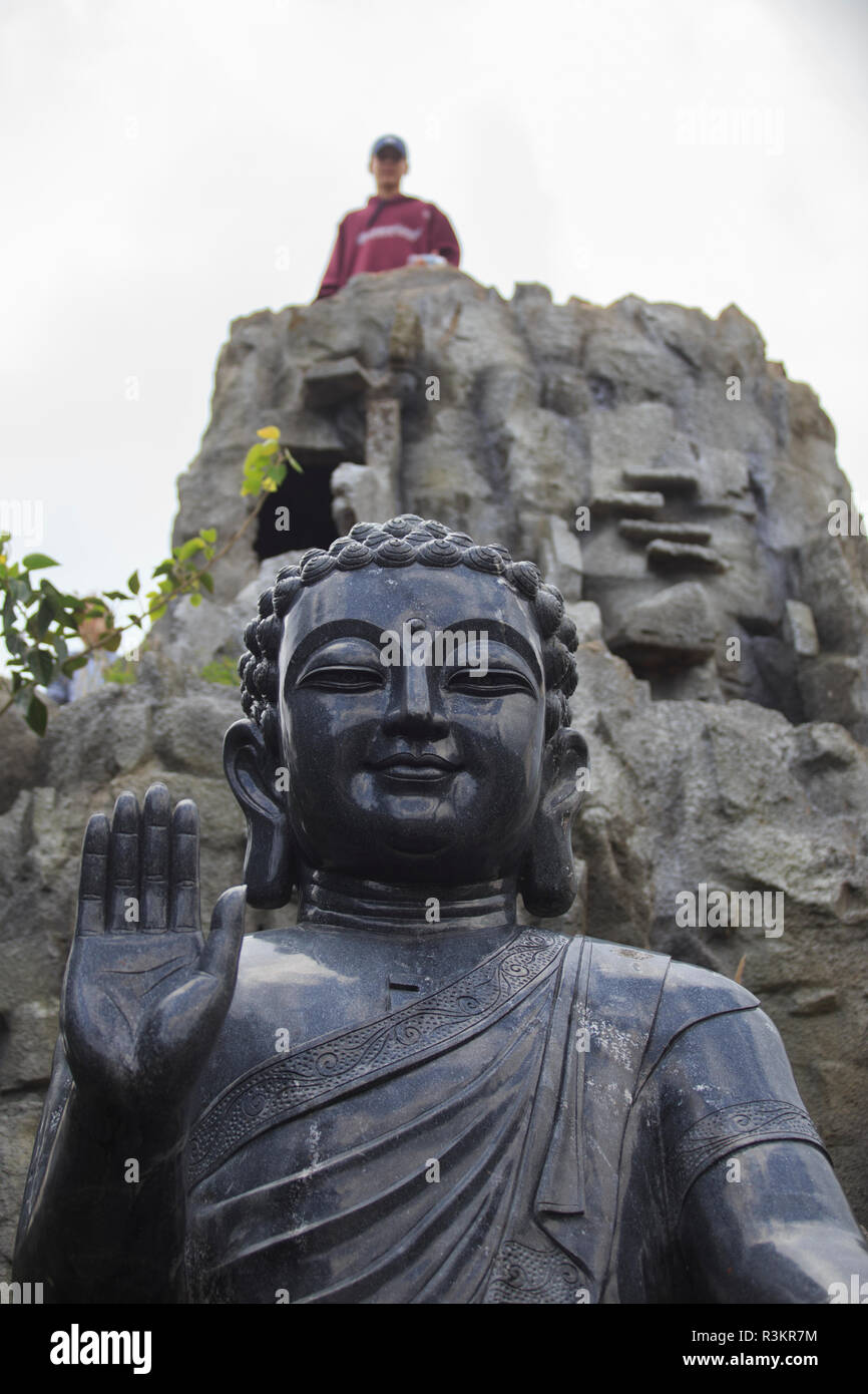 Black Buddha statue within the grounds of the Linh Ung Pagoda, Da Nang, Vietnam Stock Photo