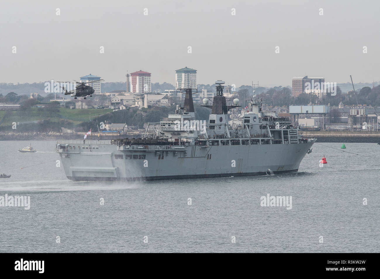Plymouth, UK. 23rd November, 2018. HMS Albion returns to Plymouth's shores today after almost 10 months at sea.  The amphibious vessel - which local leaders fought to save this summer - has had a busy 2018.  Since leaving Devonport in February, HMS Albion has steamed 33,004 nautical miles that has taken her through the Mediterranean to the Far East.   Credit: Sam Whitfield - Ultimate Shot/Alamy Live News Stock Photo