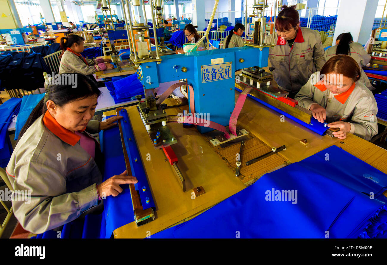 Hengshui, China's Hebei Province. 23rd Nov, 2018. Workers make medical equipment at a private enterprise in Jizhou District of Hengshui, north China's Hebei Province, Nov. 23, 2018. The district gave stronger support for private enterprises in recent years. There are more than 4,700 medical, composite material, and equipment manufacture private enterprises in Jizhou. Credit: Li Xiaoguo/Xinhua/Alamy Live News Stock Photo