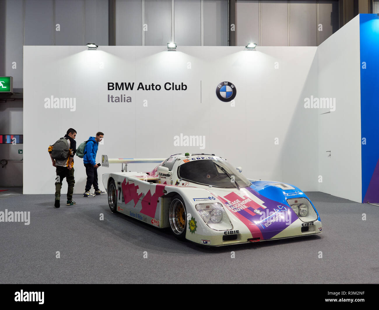 Milan, Lombardy Italy - November 23 , 2018 - Visitors of Autoclassica Milano 2018 approach a BMW racing car at BMW Auto Club stand Credit: Armando Borges/Alamy Live News Stock Photo