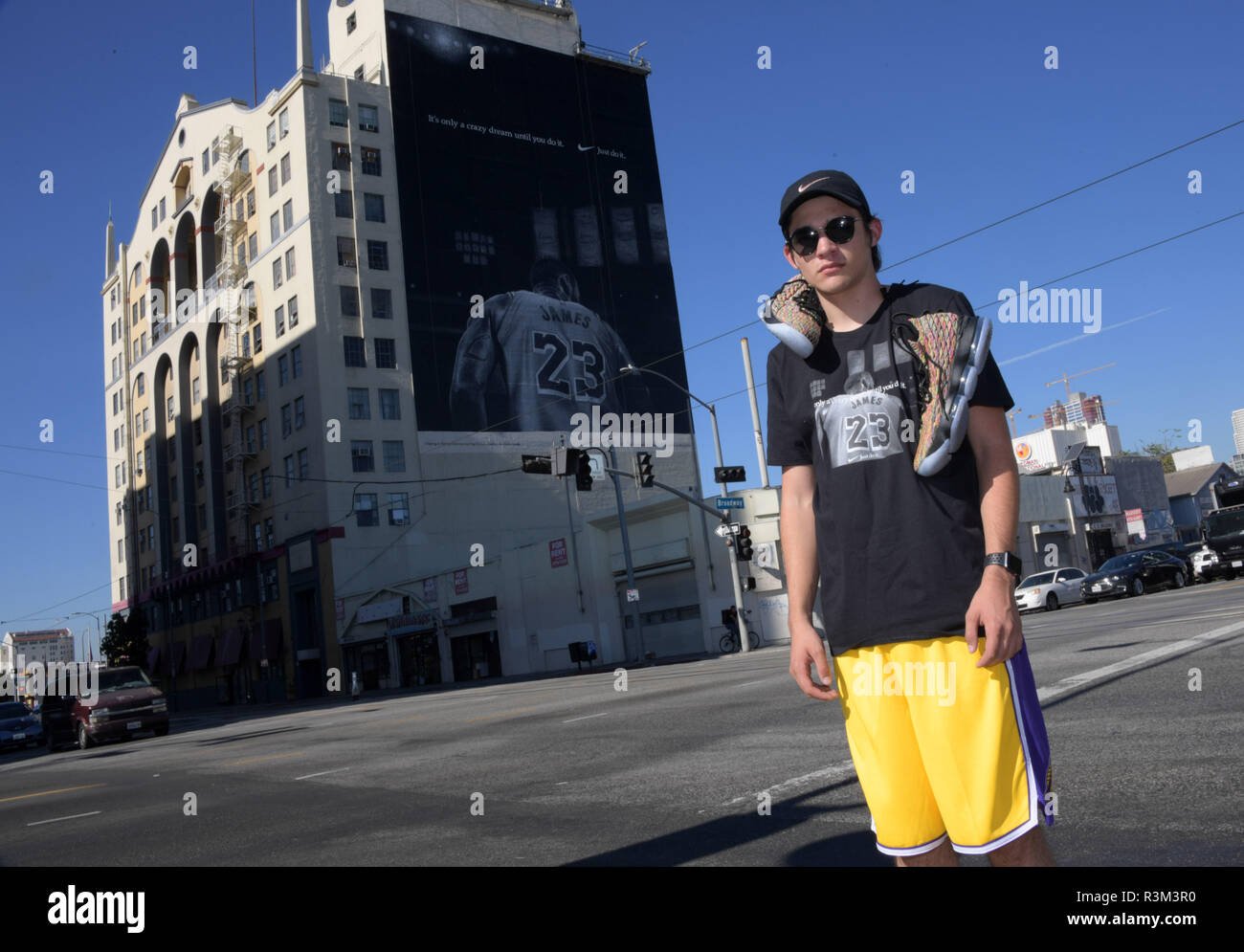 Los Angeles, United States. 02nd Nov, 2018. Dylan Stewart of Riverside,  Calif. poses in front of Nike ad featuring Los Angeles Lakers forward LeBron  James to commemorate the 30th anniversary of the "