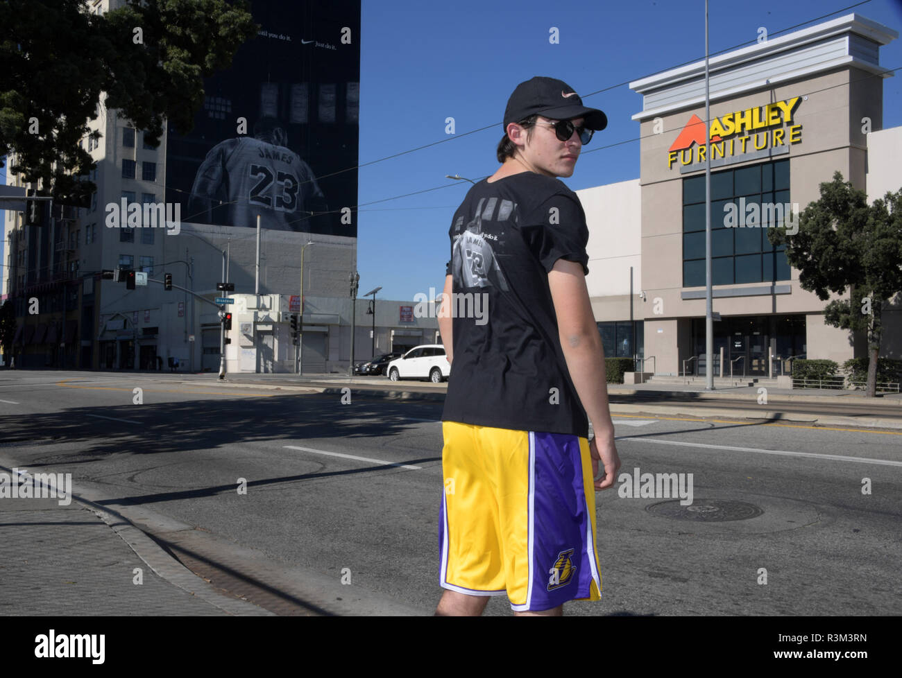 Los Angeles, United States. 02nd Nov, 2018. Dylan Stewart of Riverside,  Calif. poses in front of Nike ad featuring Los Angeles Lakers forward LeBron  James to commemorate the 30th anniversary of the "