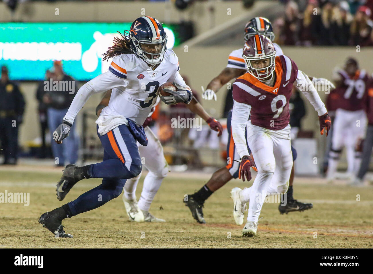 Blacksburg, VA, USA. 23rd Nov, 2018. Virginia Cavaliers quarterback Bryce Perkins (3) tries to break through the Virginia Tech defense during NCAA football action between the Virginia Cavaliers and the Virginia Tech Hokies at Lane Stadium in Blacksburg, VA. Jonathan Huff/CSM/Alamy Live News Stock Photo