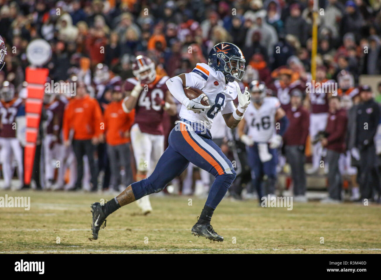 Blacksburg, VA, USA. 23rd Nov, 2018. Virginia Cavaliers wide receiver Hasise Dubois (8) breaks past the Virginia Tech defense to score during NCAA football action between the Virginia Cavaliers and the Virginia Tech Hokies at Lane Stadium in Blacksburg, VA. Jonathan Huff/CSM/Alamy Live News Stock Photo