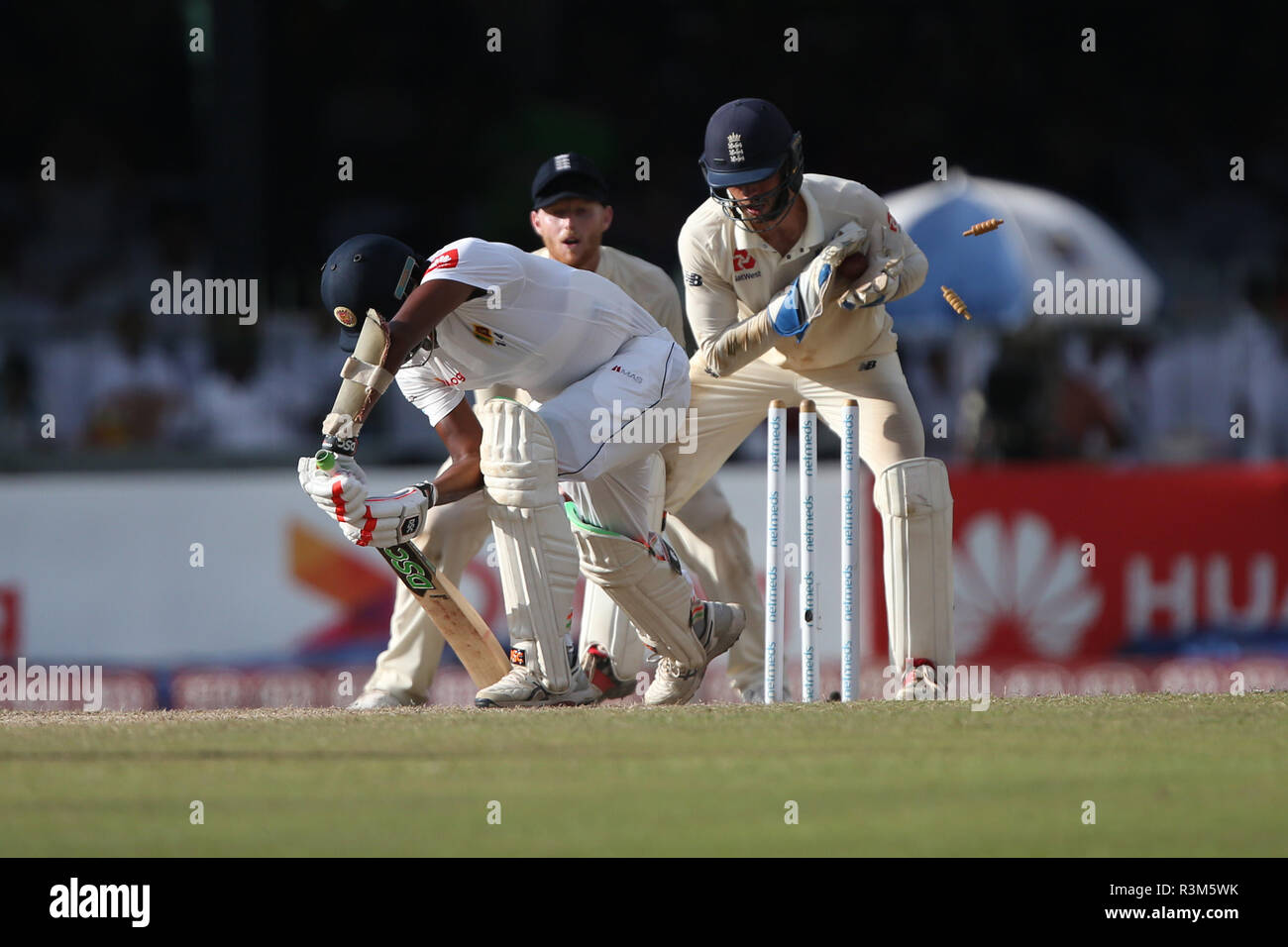 24th November 2018, Sinhalese Sports Club Ground, Colombo, Sri Lanka; International Test Cricket, third test, day 2, Sri Lanka versus England; Suranga Lakmal misses the ball as Ben Foakes knocks the bails of the stumps Stock Photo