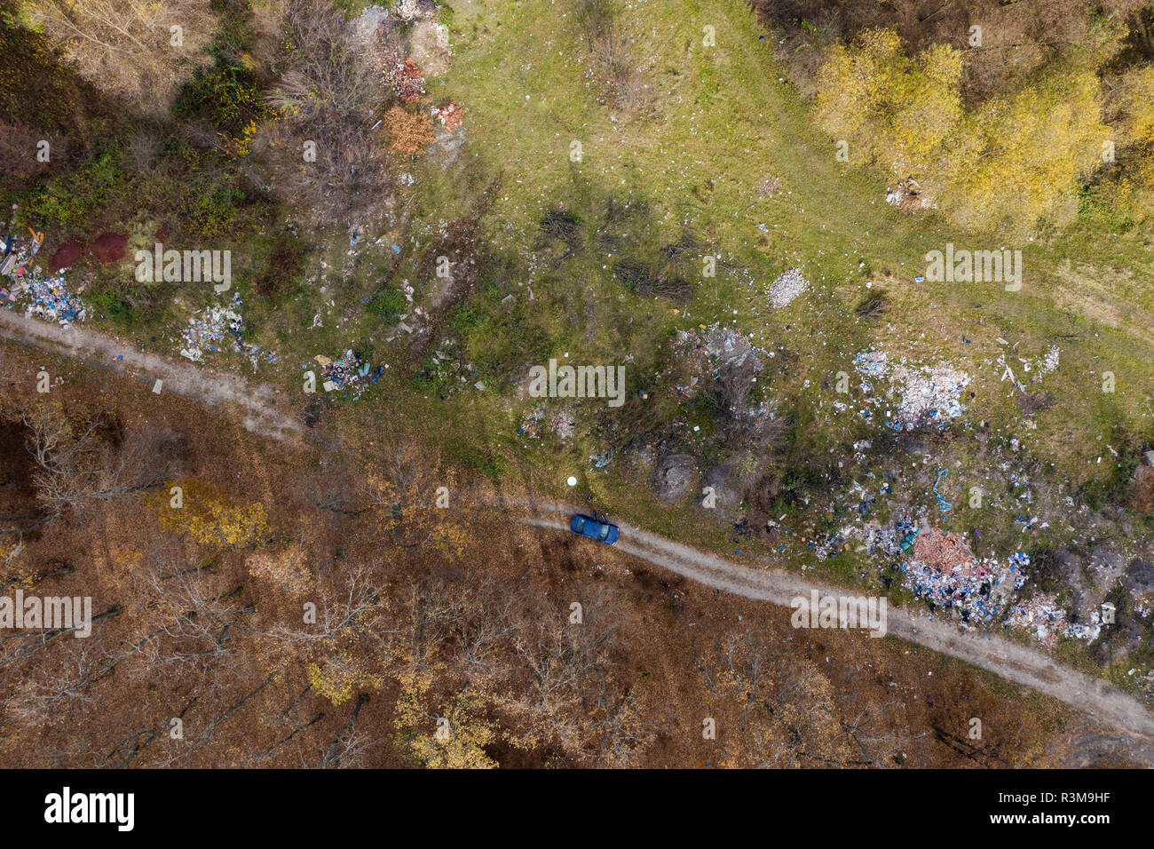 Aerial drone view of nature polluted with domestic and industrial waste. Landfill environmental pollution, trash dump Stock Photo