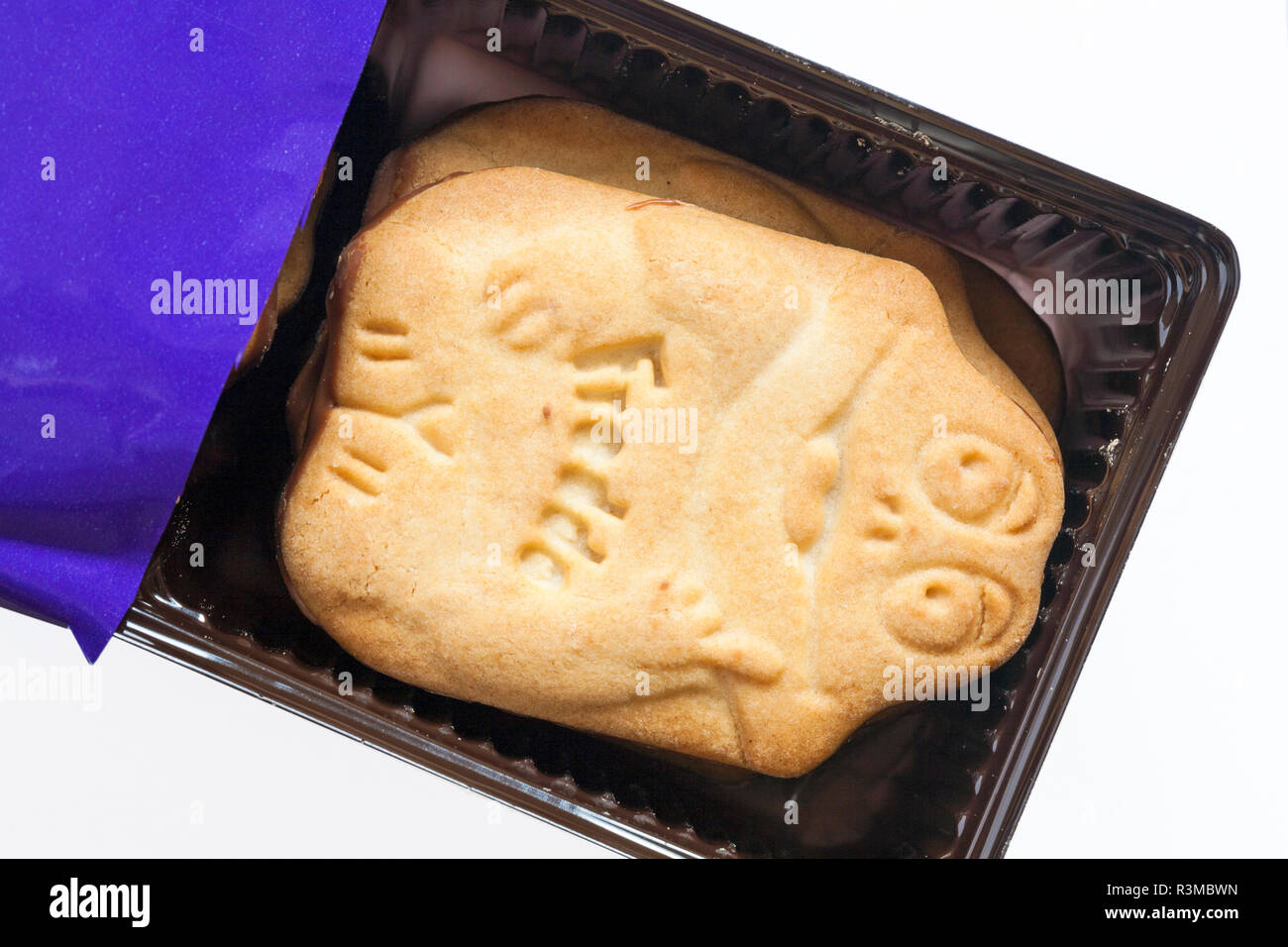 packet of Cadbury Freddo Biscuits delicious biscuits dipped in milk chocolate opened to show contents set on white background Stock Photo