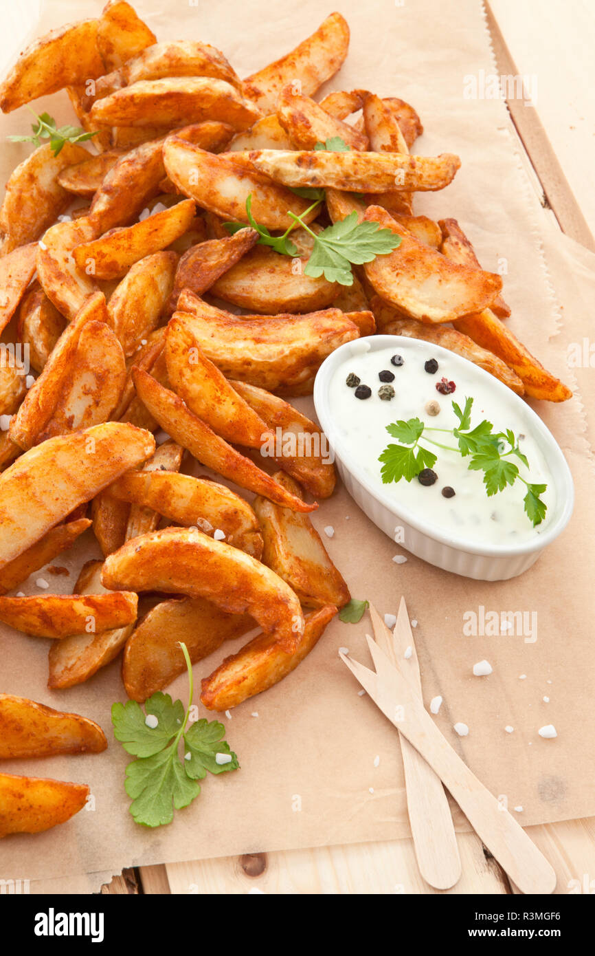 fresh potato wedges with dip Stock Photo Alamy