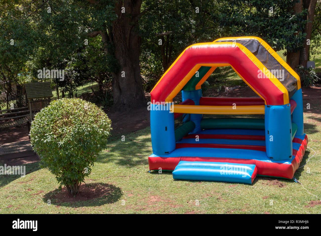 A Close up top view of a very colourful blown up jumping castle in the