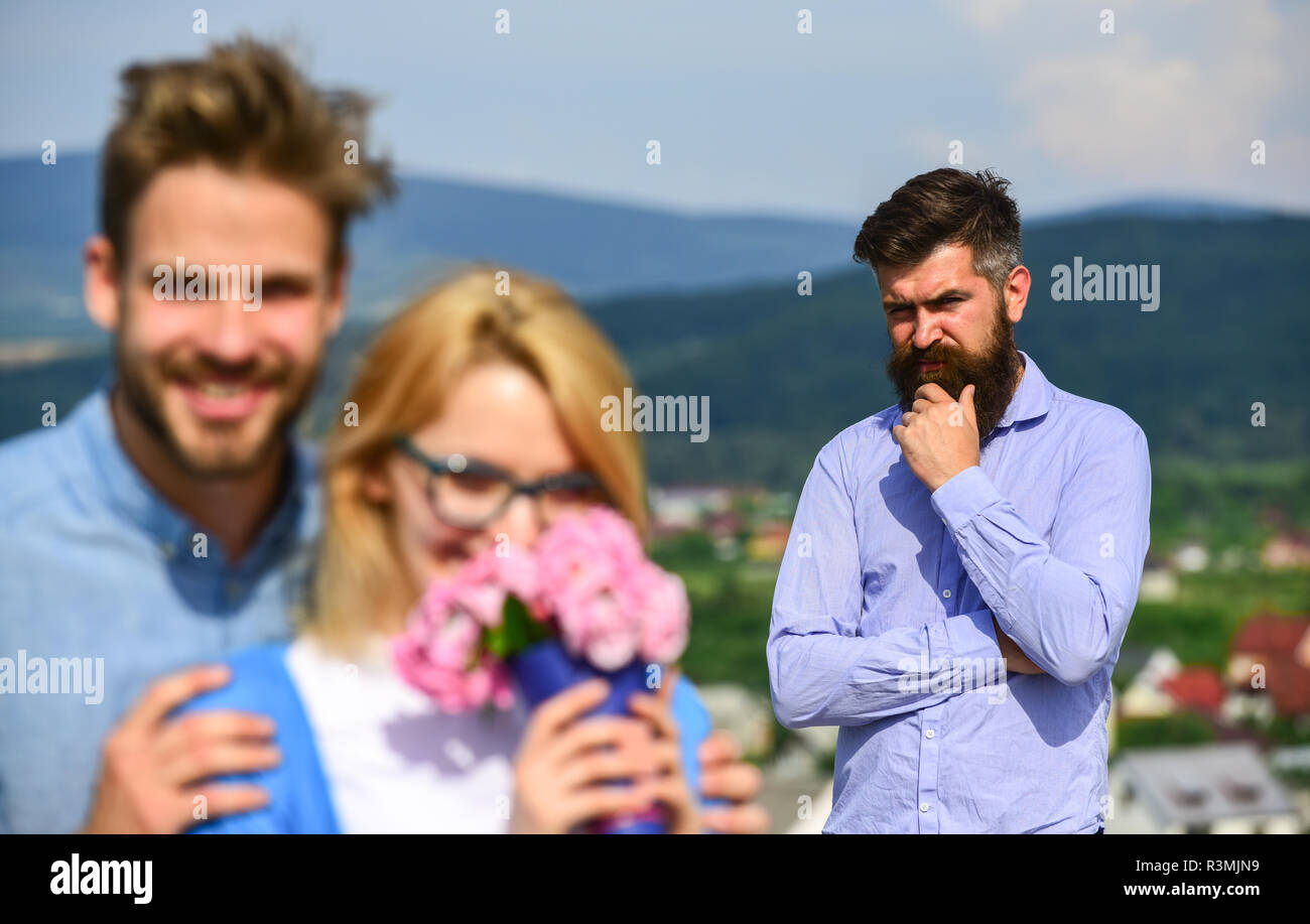 Lovers hugs outdoor flirt romance relations. Infidelity concept. Couple in  love dating while jealous bearded man watching wife cheating him with lover  Stock Photo - Alamy